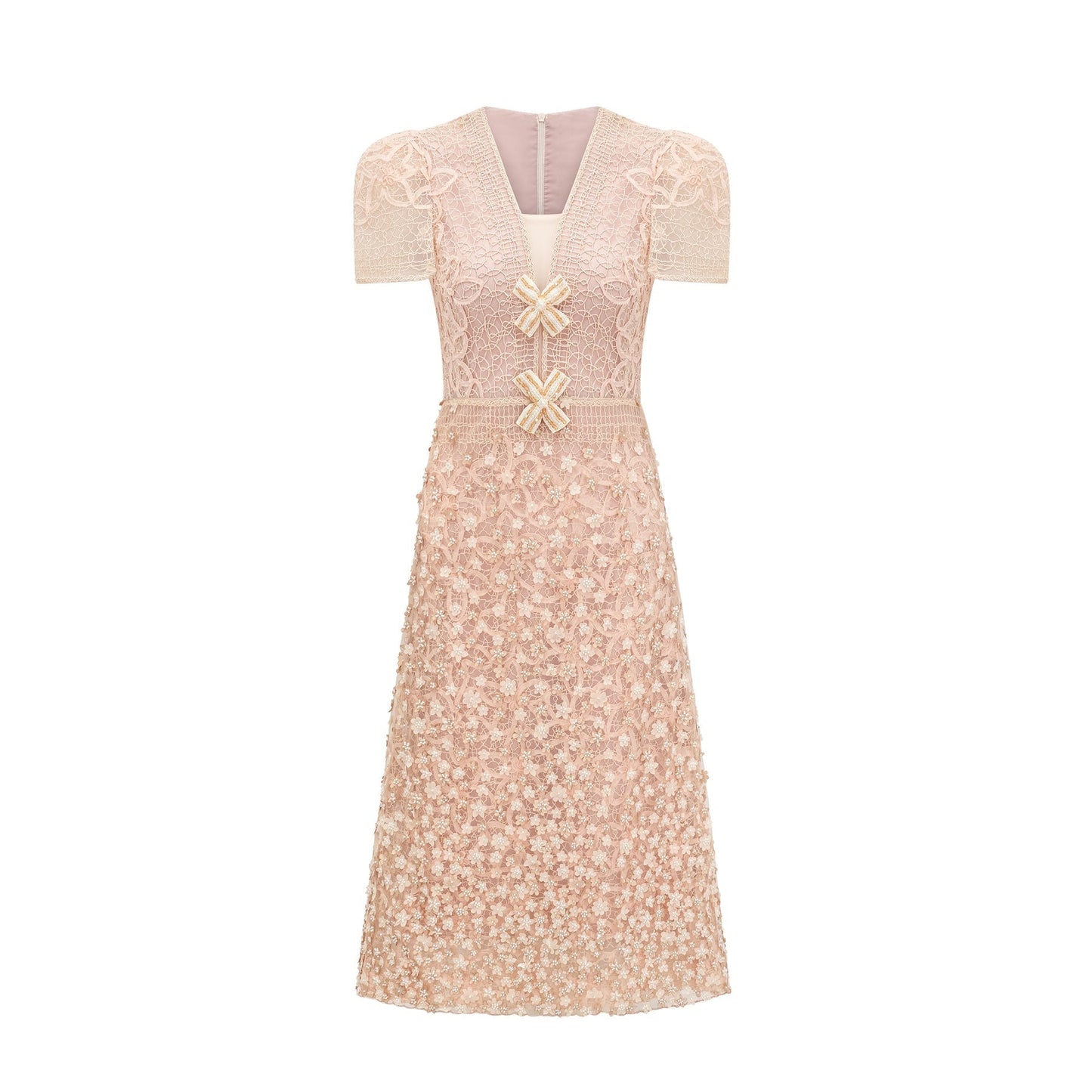 A beige midi dress with crochet detailing and faux flower embellishments in neutral tones