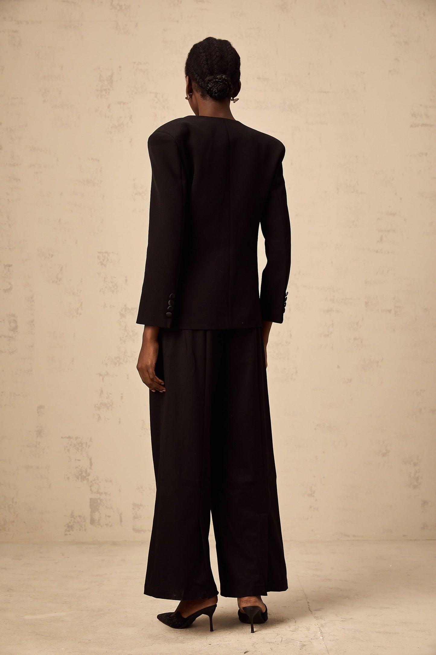 A black blazer with a floral pattern featuring embellished flower motifs named Therese