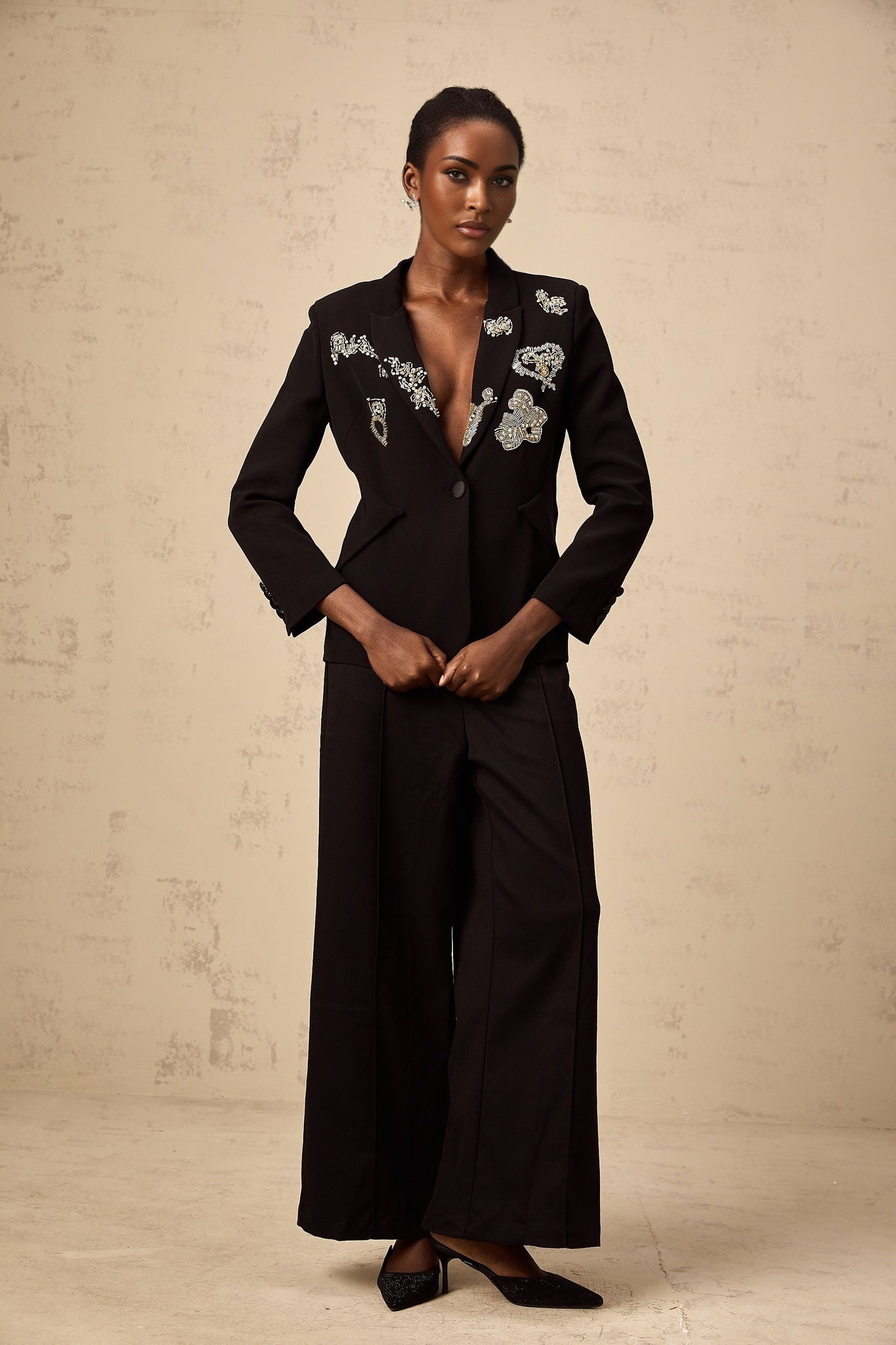 A black blazer with intricate bead embroidery details named Ximena