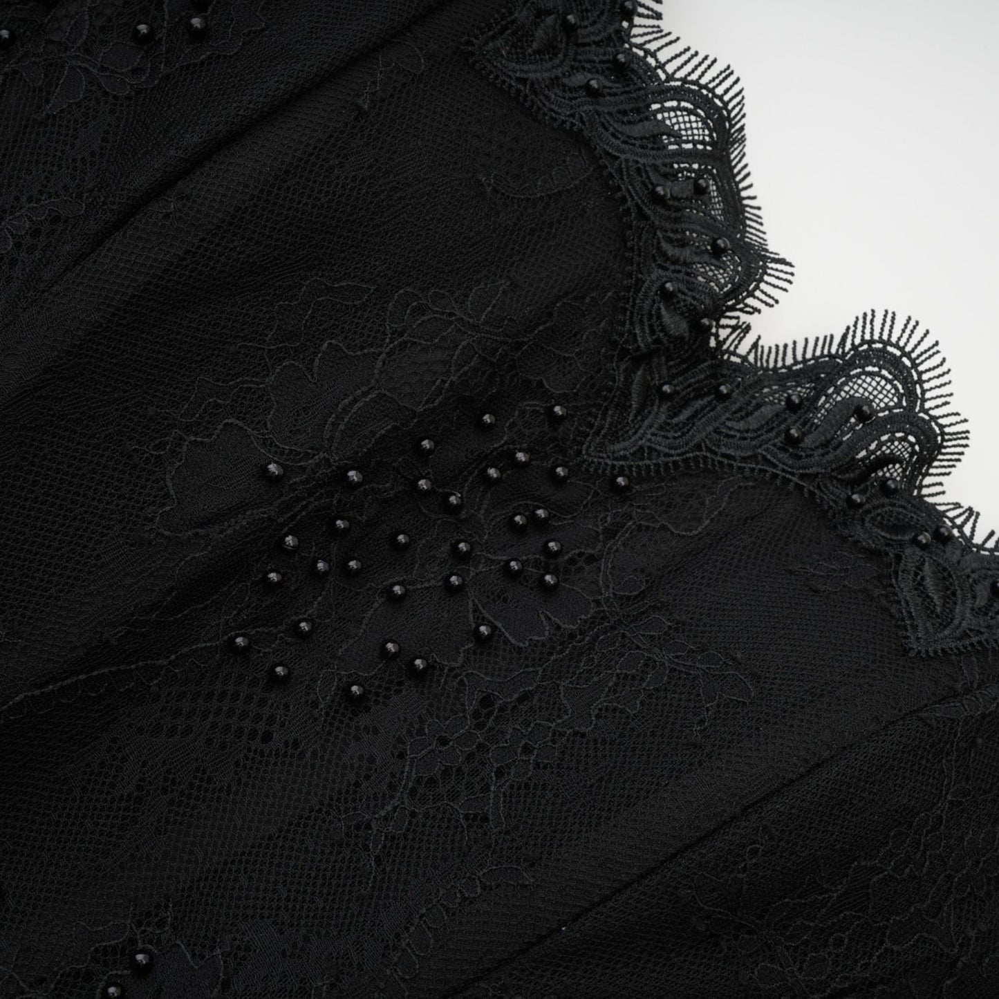 Black offshoulder dress with mesh design lace details fauxpearl embellishments and ribbon accent