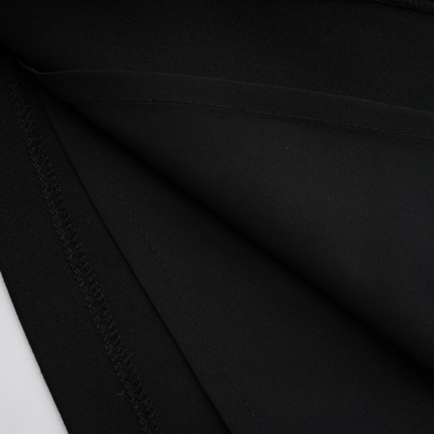 Black vneck dress with structured boned bodice chest flap pockets and thighlength coverage