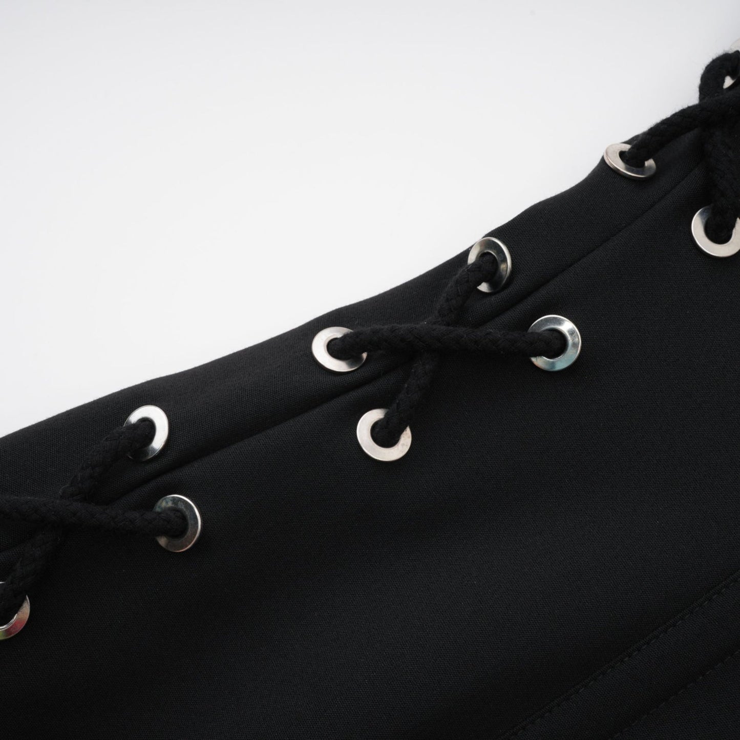 Black sleeveless dress with Vneck boned bodice and chest flap pockets Made of 98% Organic Cotton and 2% Elastane