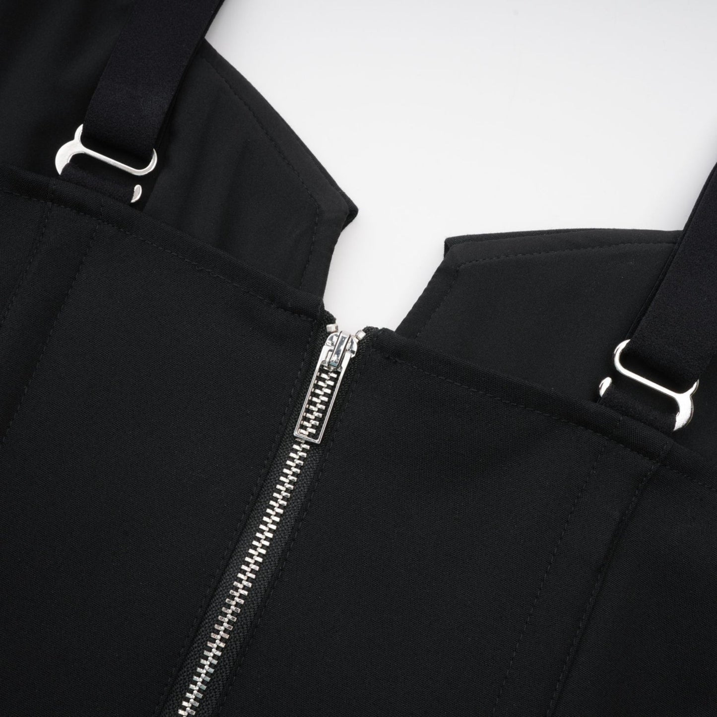 Black sleeveless dress with Vneck boned bodice adjustable straps rear zip fastening chest flap pockets and thighlength hem Made of 98% Organic Cotton and 2% Elastane