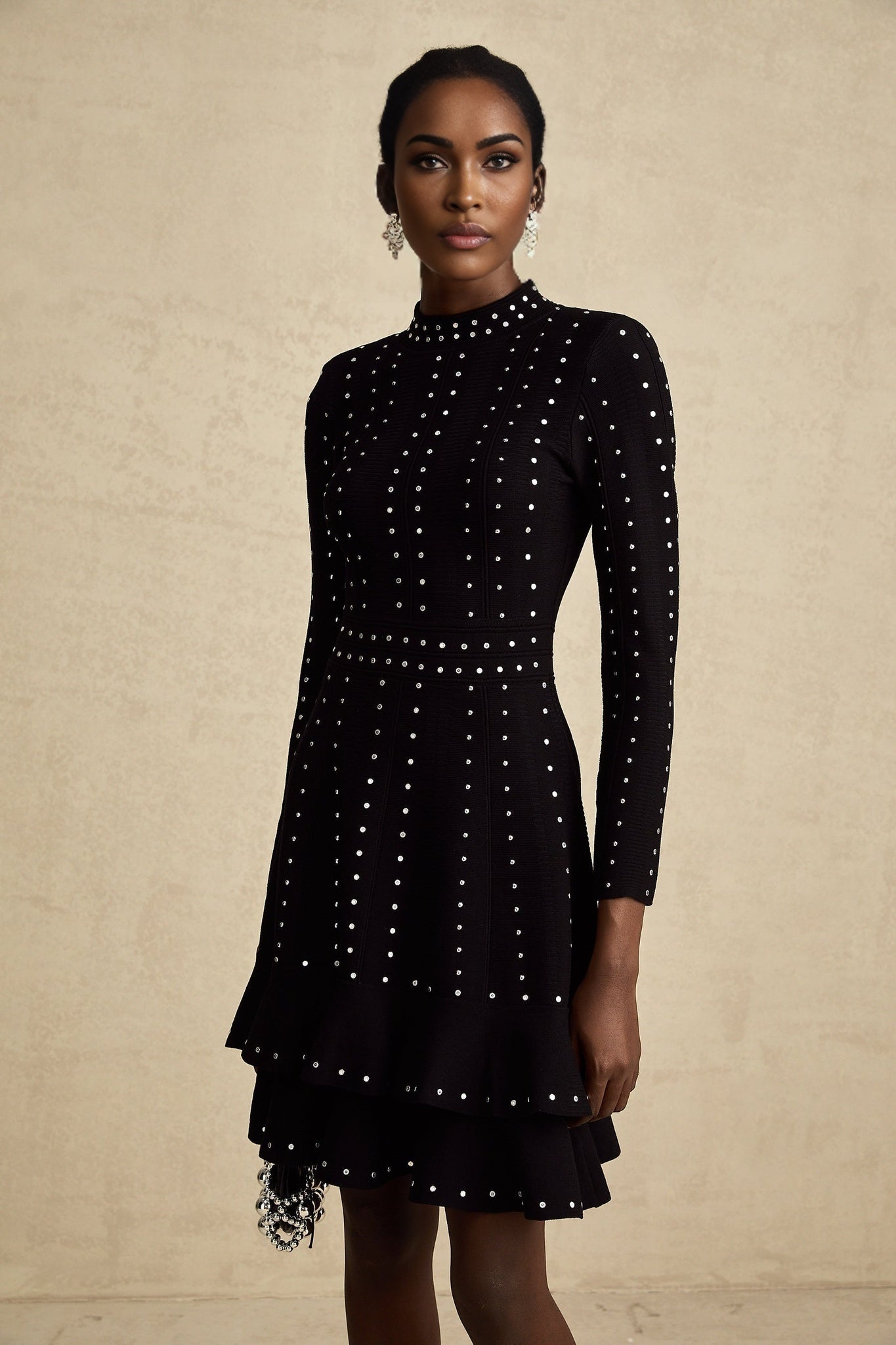 A black knitted mini dress with embellishments and ruffled details named Fabienne