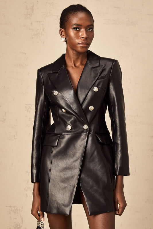 A black leather blazer mini dress featuring a tailored fit collar lapels and long sleeves styled as a short dress with a feminine silhouette