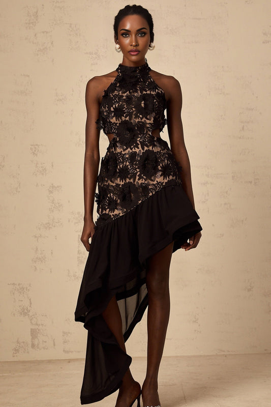 A black midi dress with an asymmetric hem featuring floral applique details named Bernadette