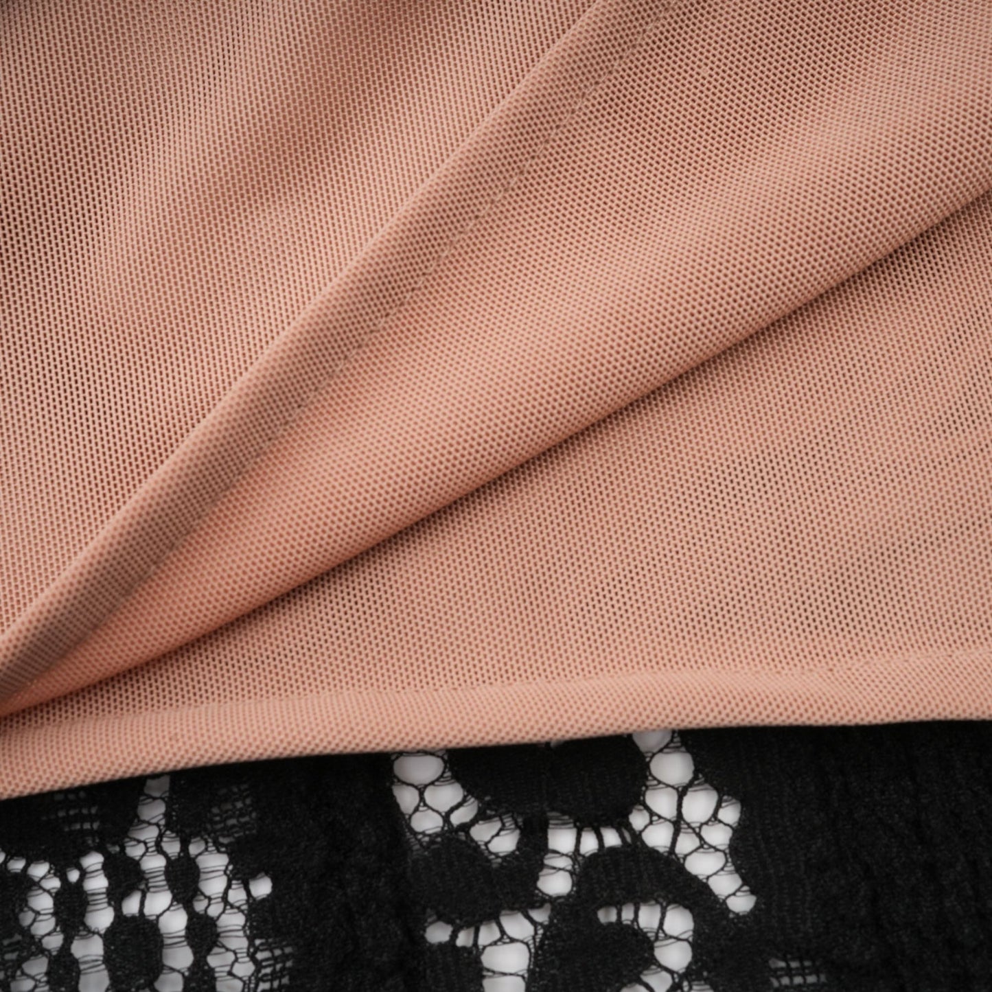 A black midi dress with floral lace detailing and flared cuffs named Émeline