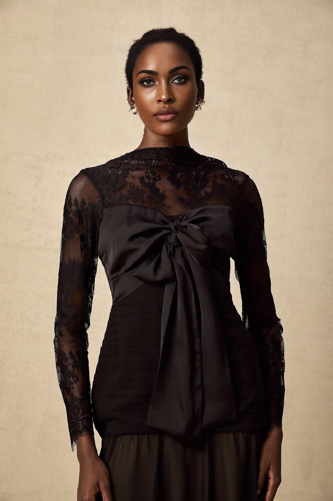A black midi dress with floral lace panels named Amelie