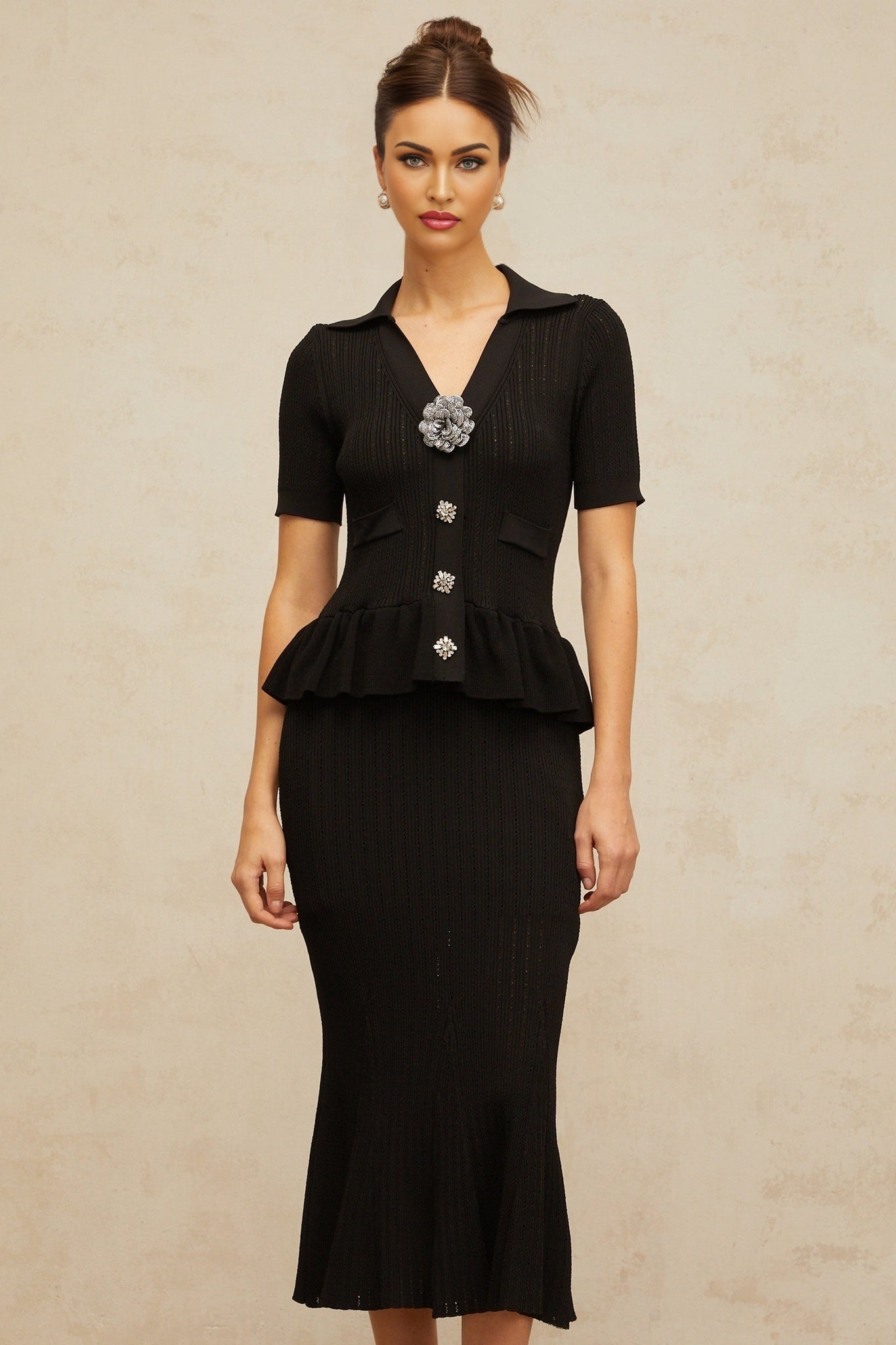 A black midi dress with pointelle knit detailing and embellishments named Felicie