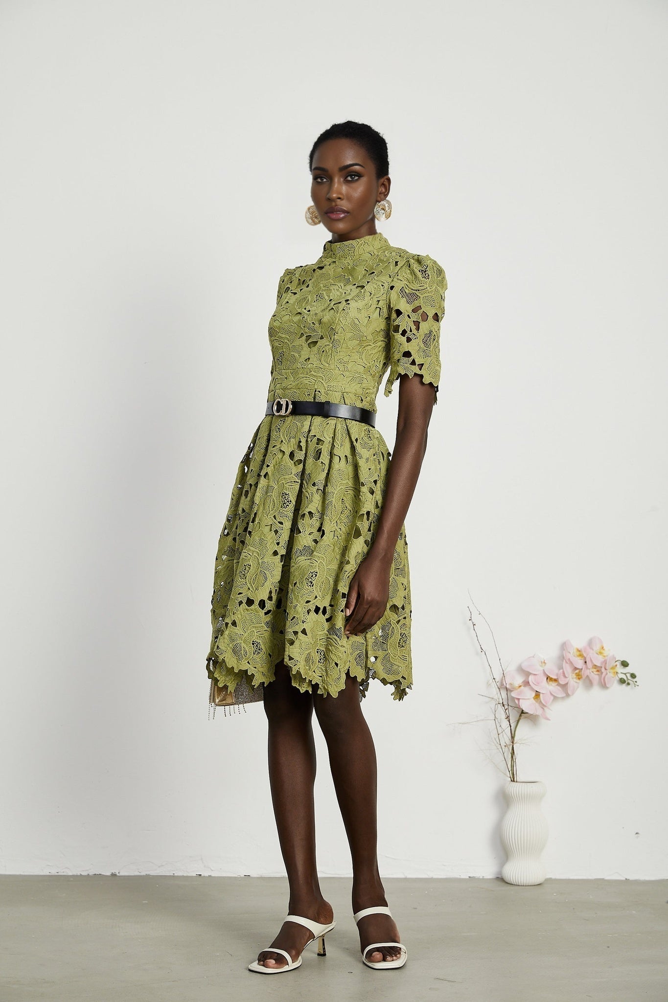 A black mini dress with embroidery and cut out details named Valerie