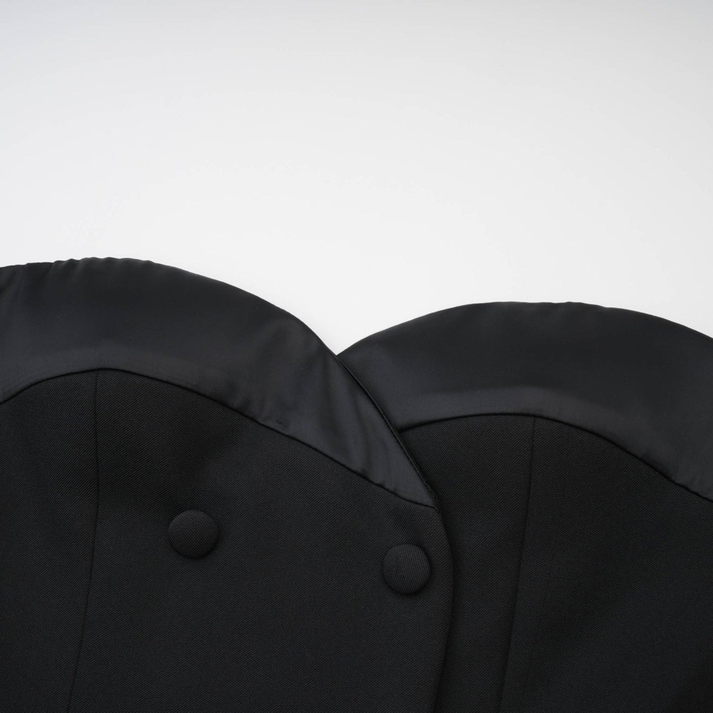 Sleek black bustier dress with doublebreasted buttons cinched waist and lace trims