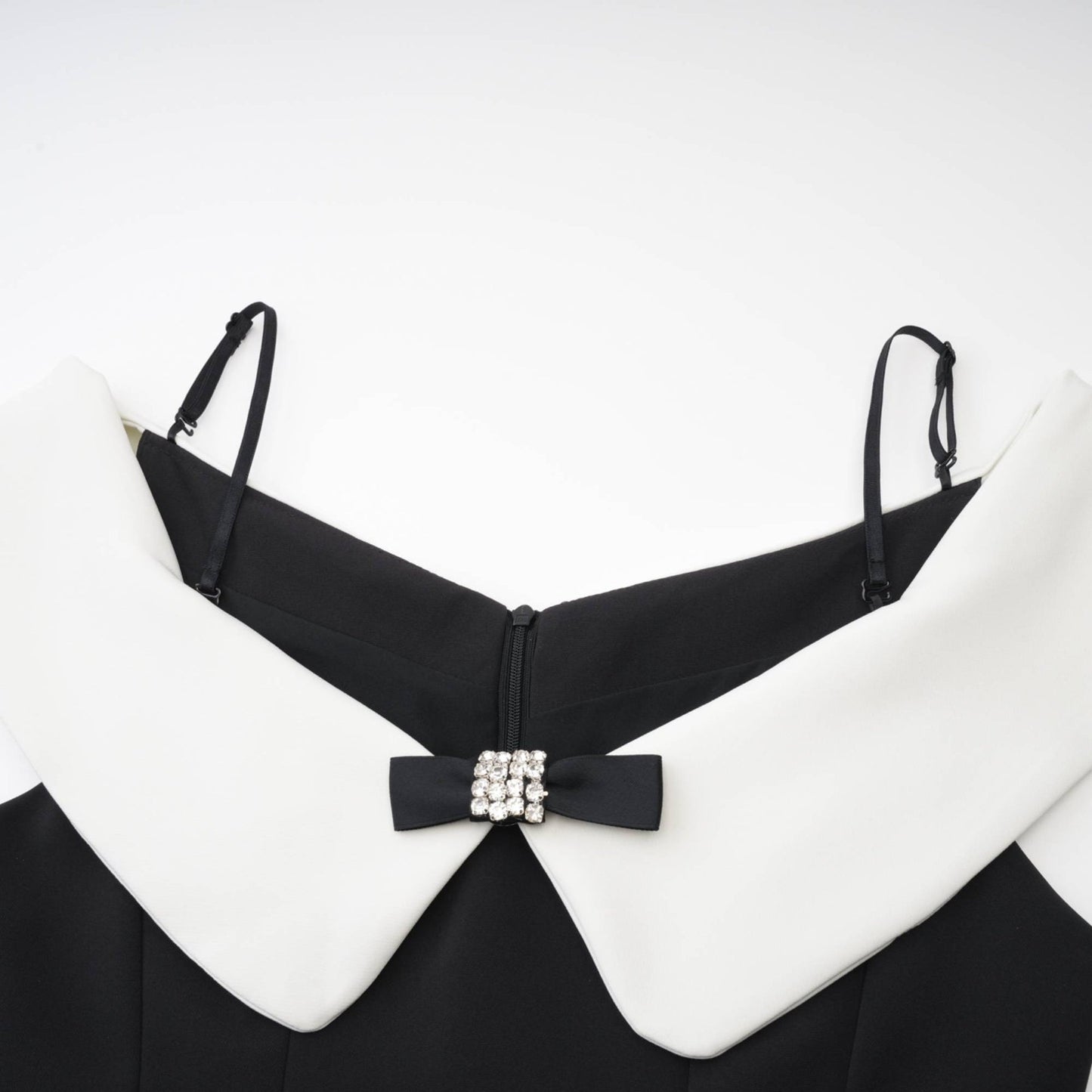 Black mini dress with reversible collar contrast colors off the shoulder style and pleated design made of 82% Cotton 18% Silk