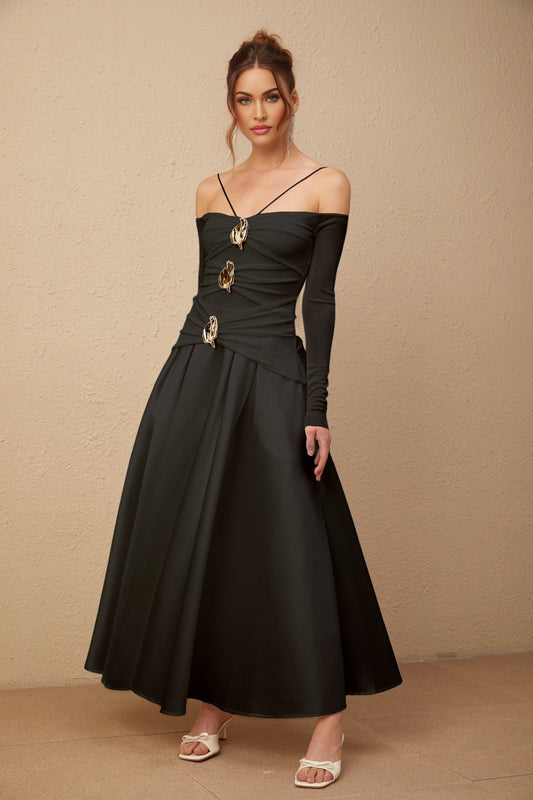 A black offshoulder maxi dress with panelled design worn by a model named Nadine