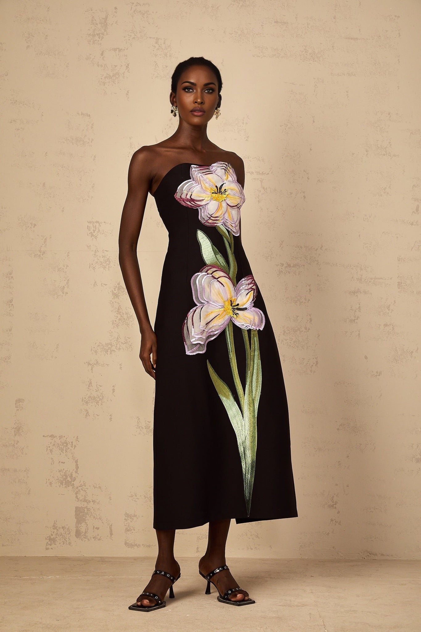 A black offshoulder midi dress with sequin embroidery details named Irene featuring a fitted silhouette and elegant design