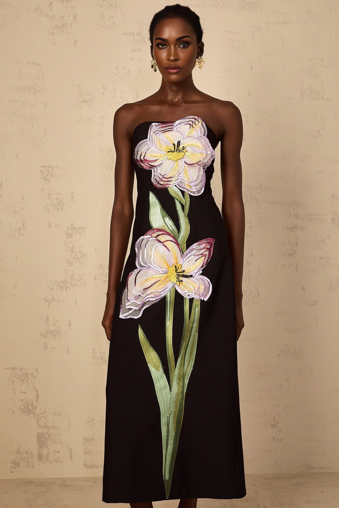 A black offshoulder midi dress with sequin embroidery named Irene featuring a fitted silhouette and elegant design