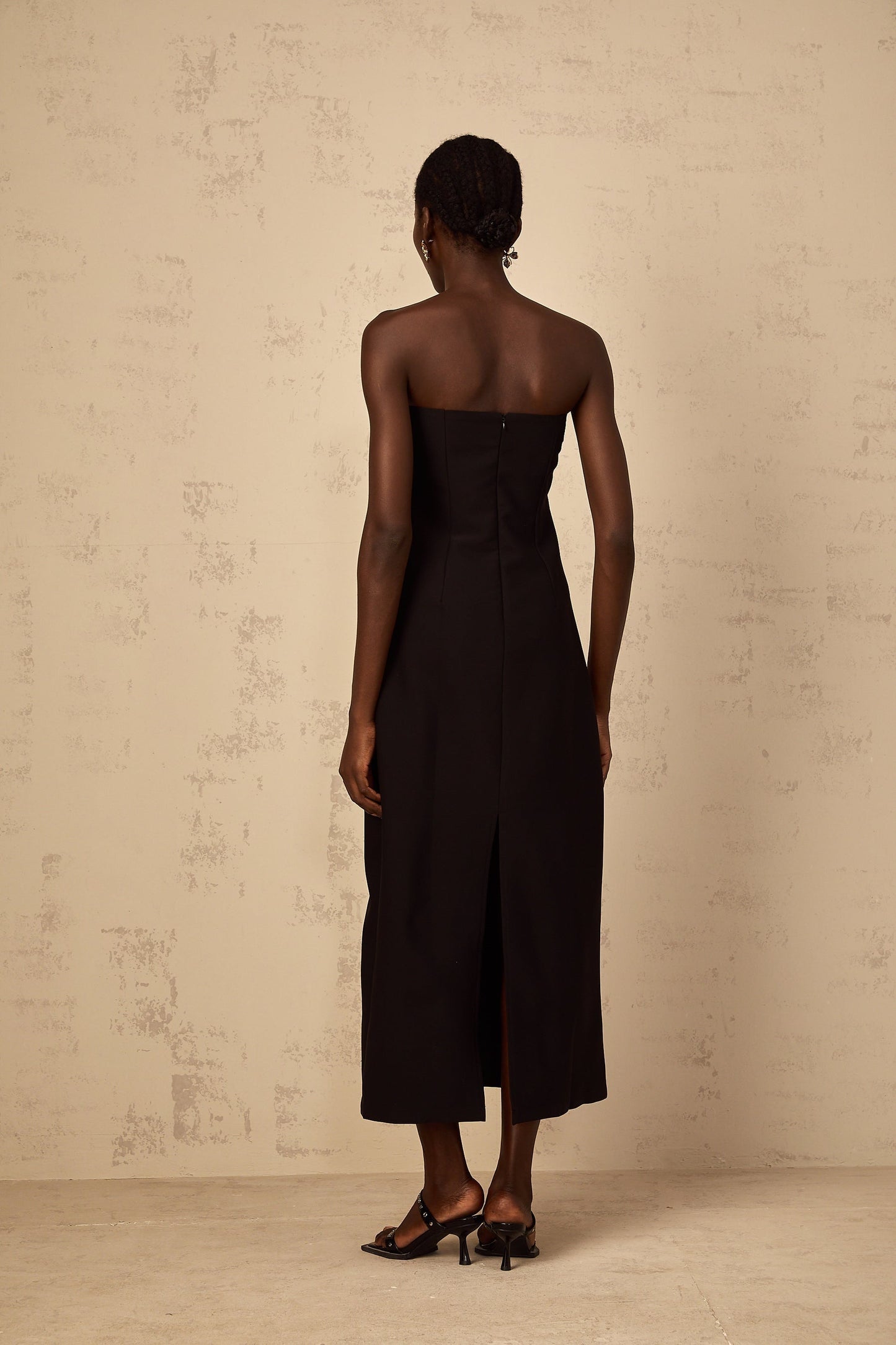 A black offshoulder midi dress with sequin embroidery named Irene featuring a fitted silhouette and elegant design