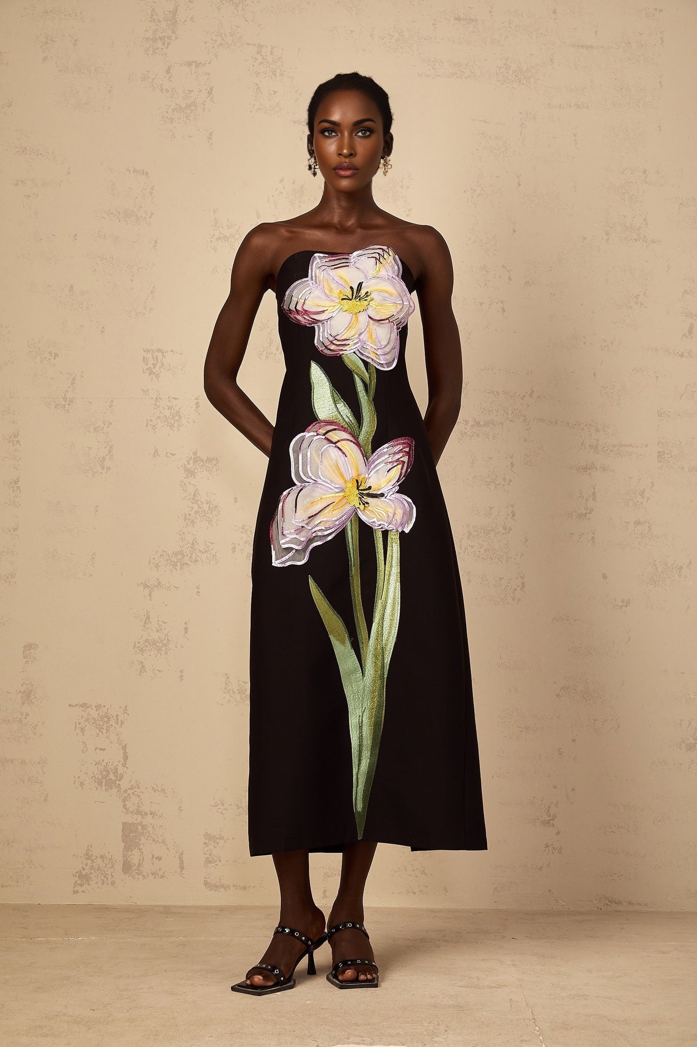 A black offshoulder midi dress with sequin embroidery named Irene featuring a fitted silhouette and elegant design