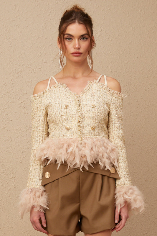 A black tweed offshoulder top with white feather trim along the neckline and cuffs named Laetiecia