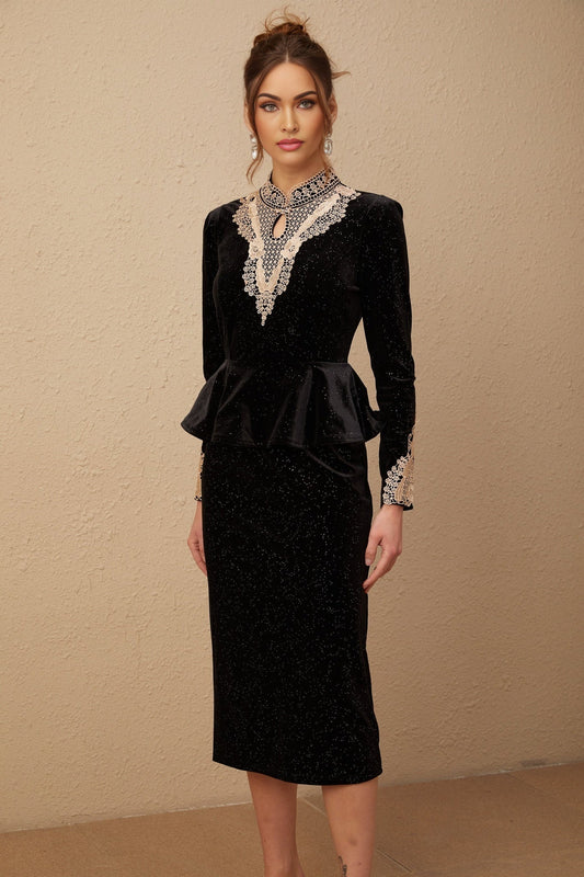 A black velvet midi dress with embellishments named Roxane featuring a sleek silhouette and elegant design