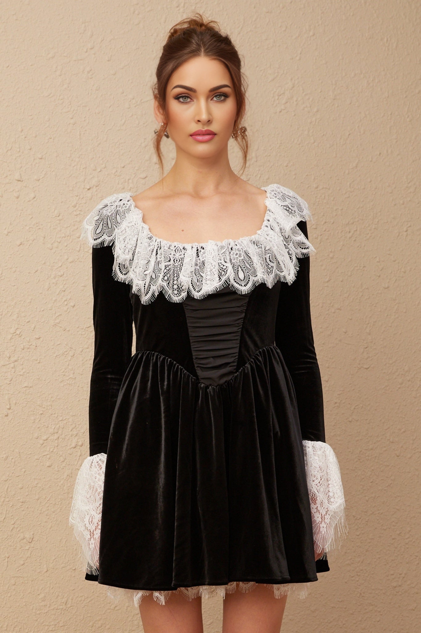 A black velvet mini dress with lace trim details named Fabiana