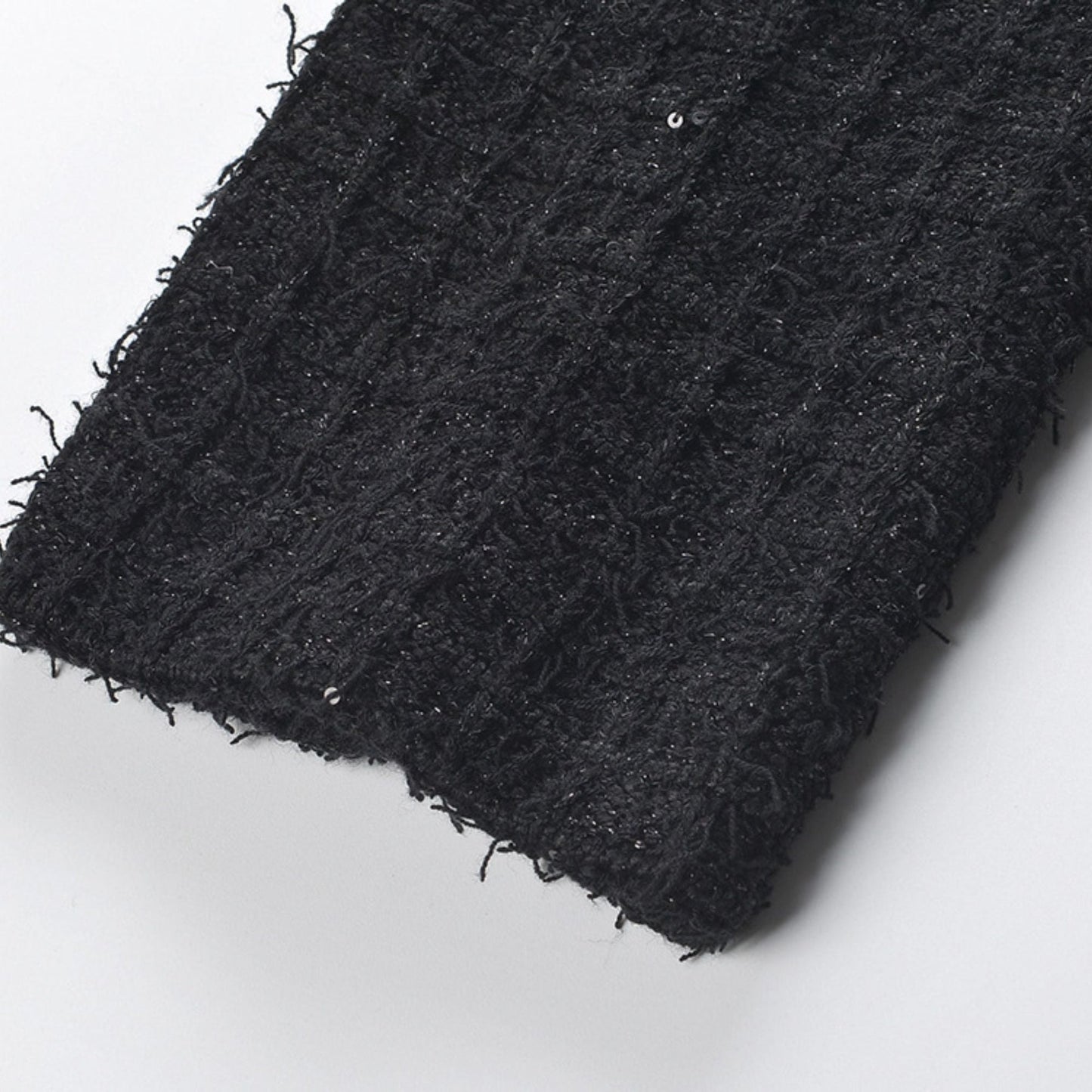 Black waffleknit dress with notched lapels long sleeves and front button fastening Made of 80% polyester and 20% cotton