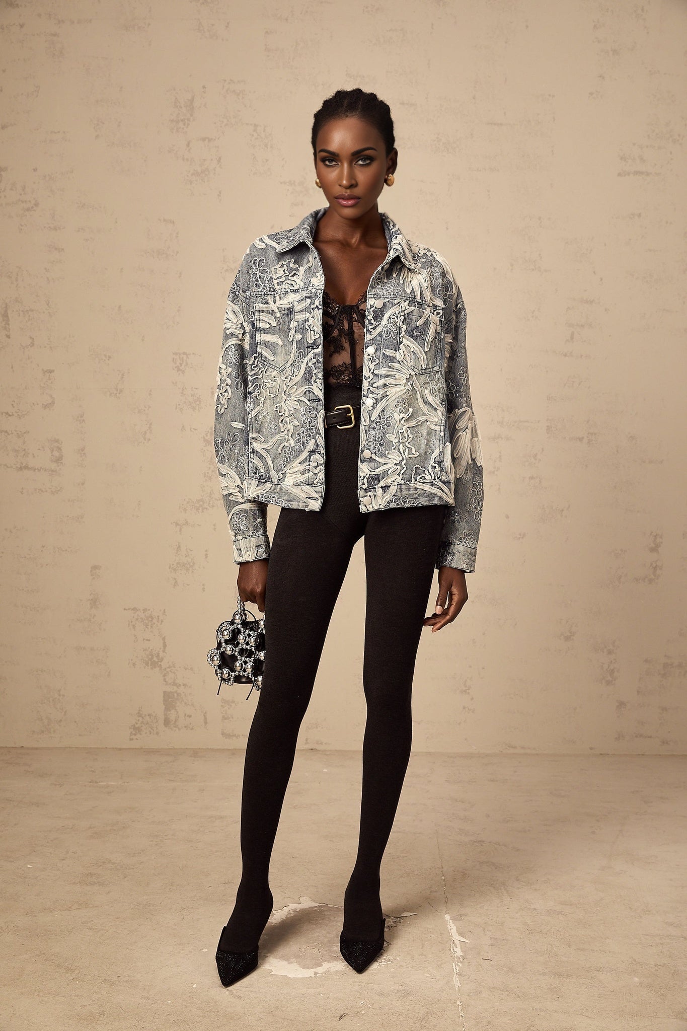 A blue denim jacket with sequined flower embroidery featuring a design called Mailys