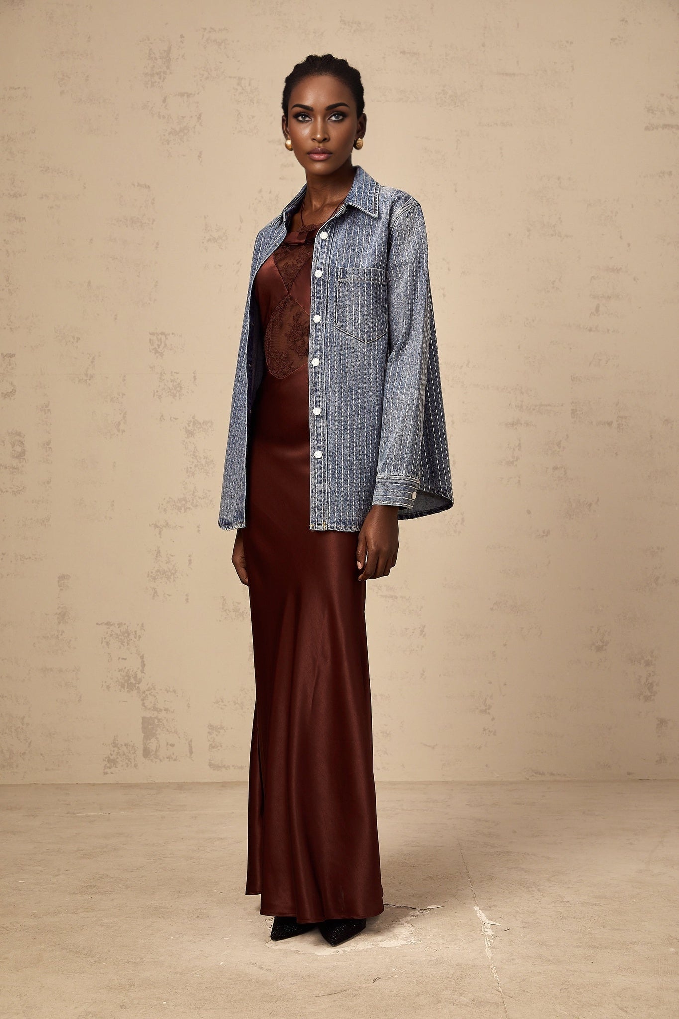 A blue denim shirt with vertical stripes and embellishments featuring the Josephine design