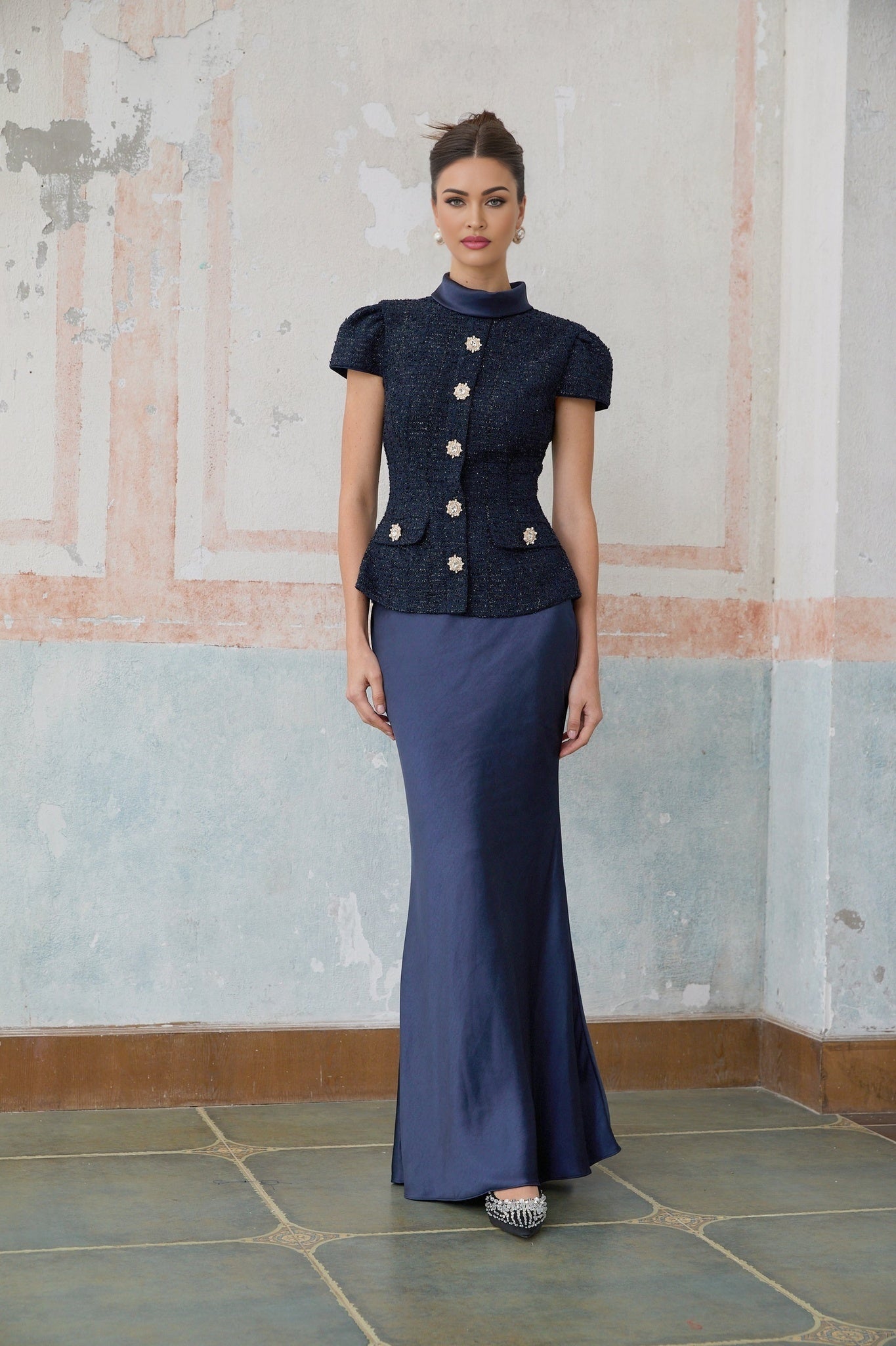A blue maxi dress with a peplum waist and paneled design named Josette