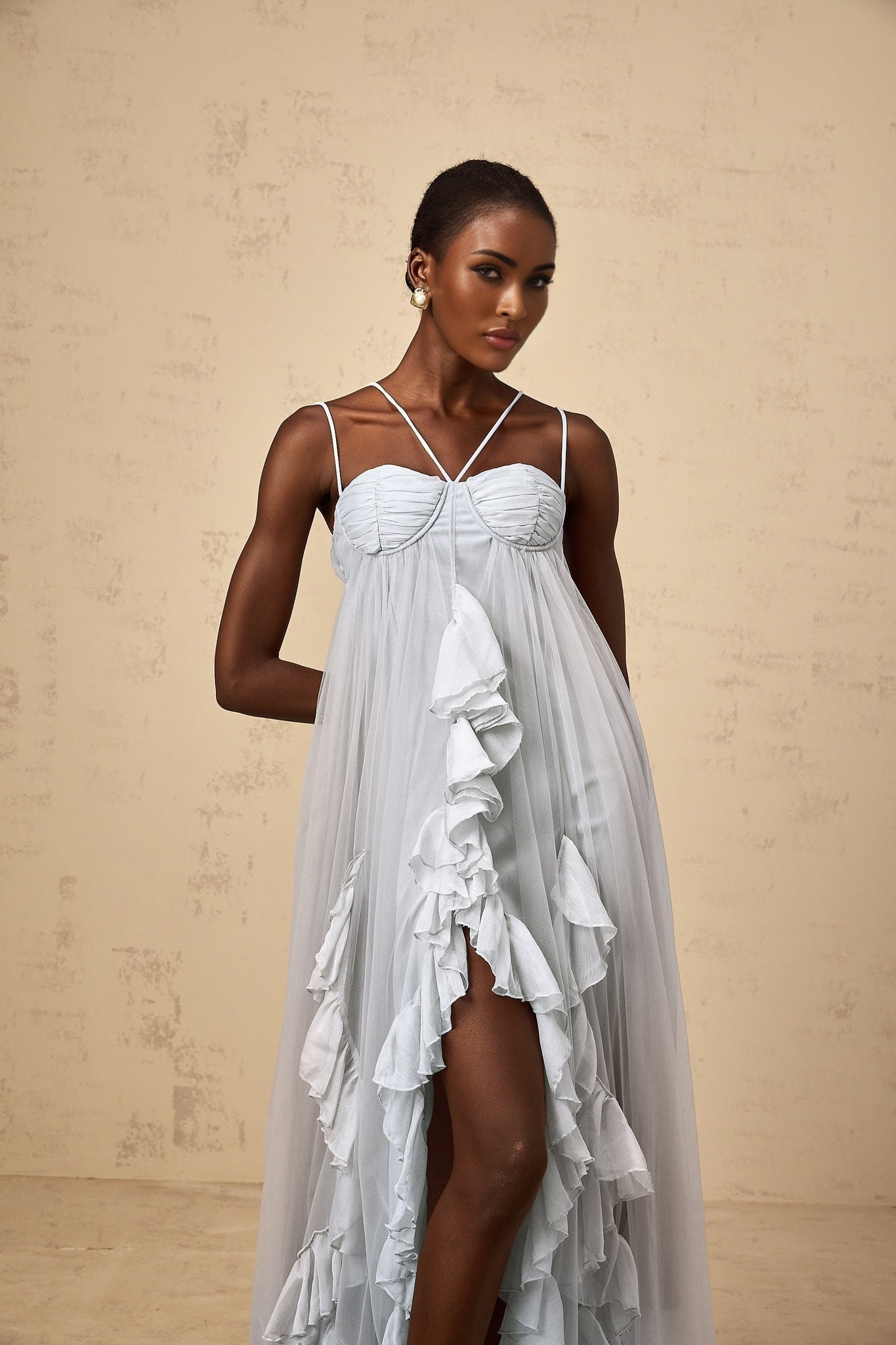 A blue maxi dress with layered ruffled tulle skirt and sleeveless bodice named Colette
