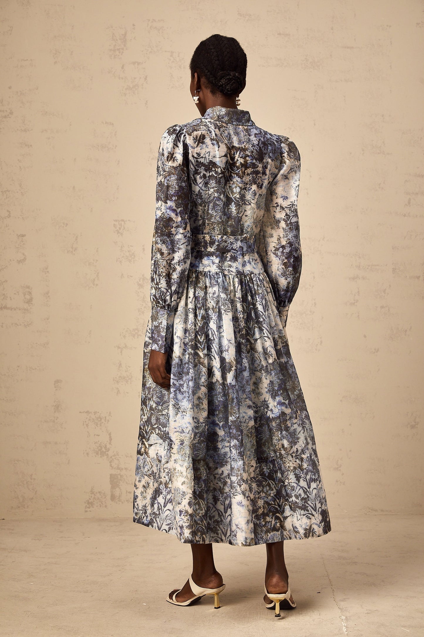 A blue midi dress with a floral print pattern named Irina