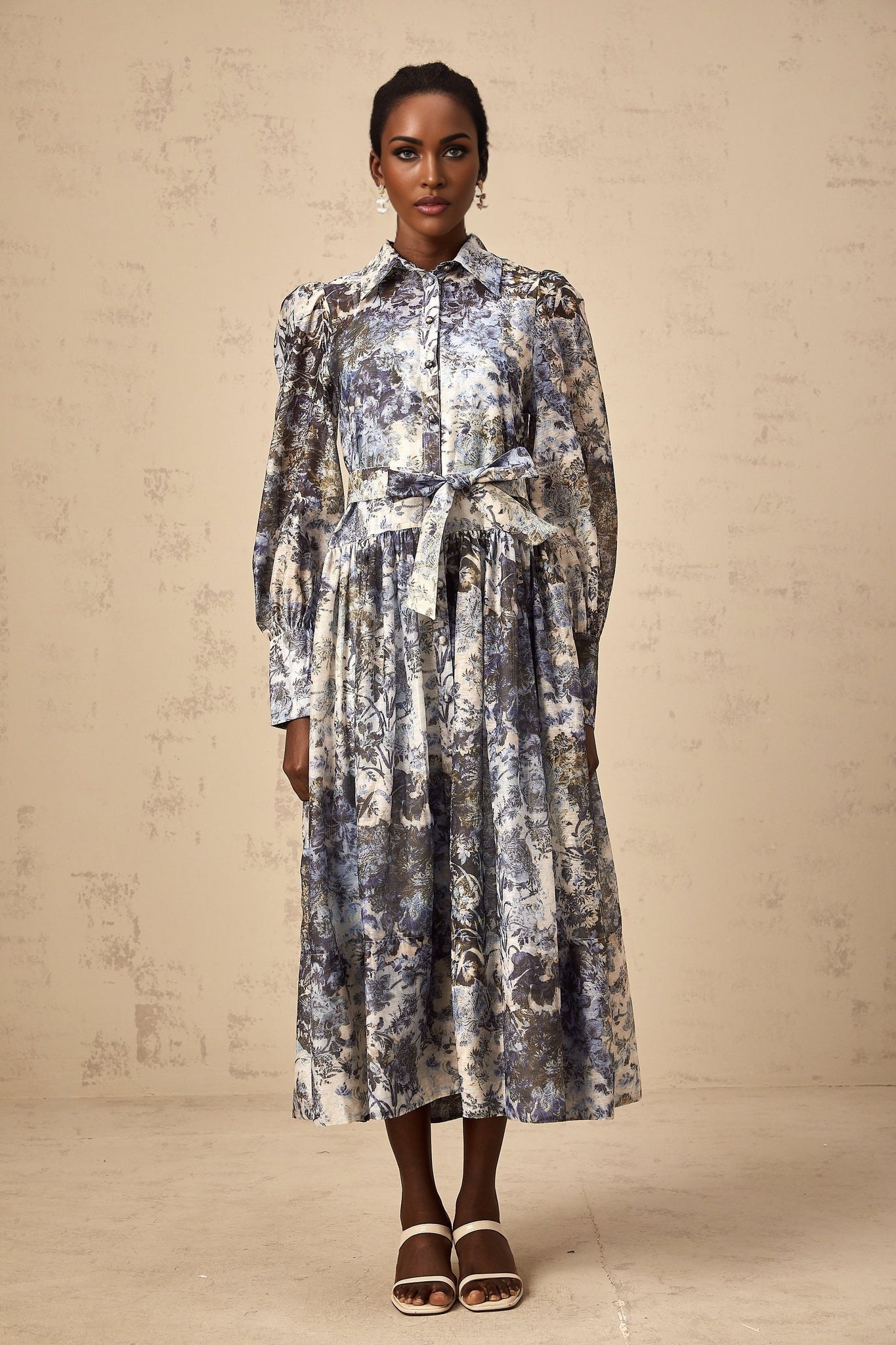 A blue midi dress with a floral print pattern named Irina