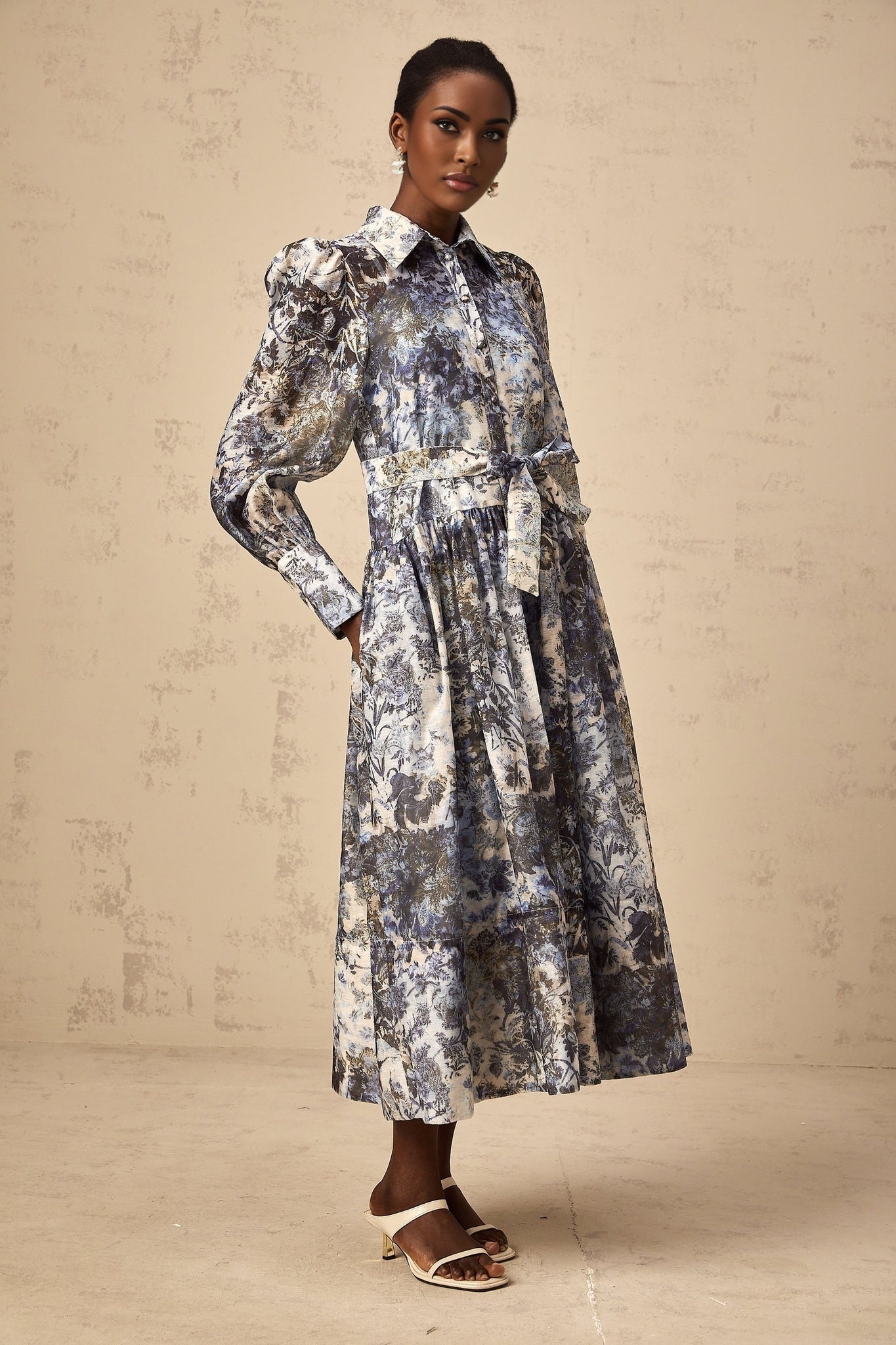 A blue midi dress with a floral print pattern named Irina