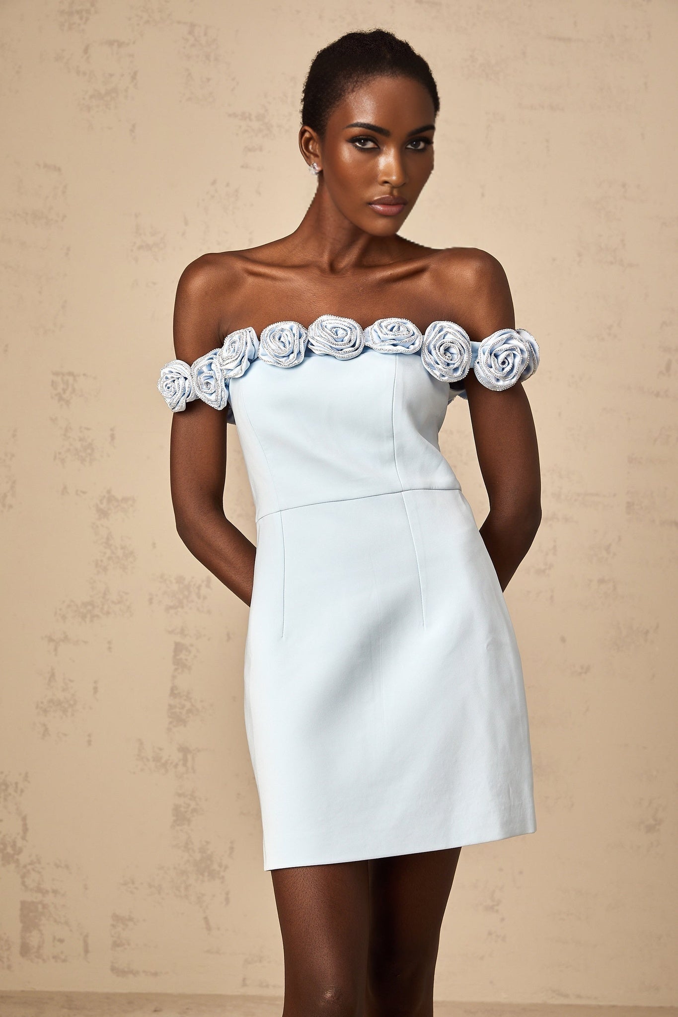 A blue mini dress with floral applique details named Hedwige