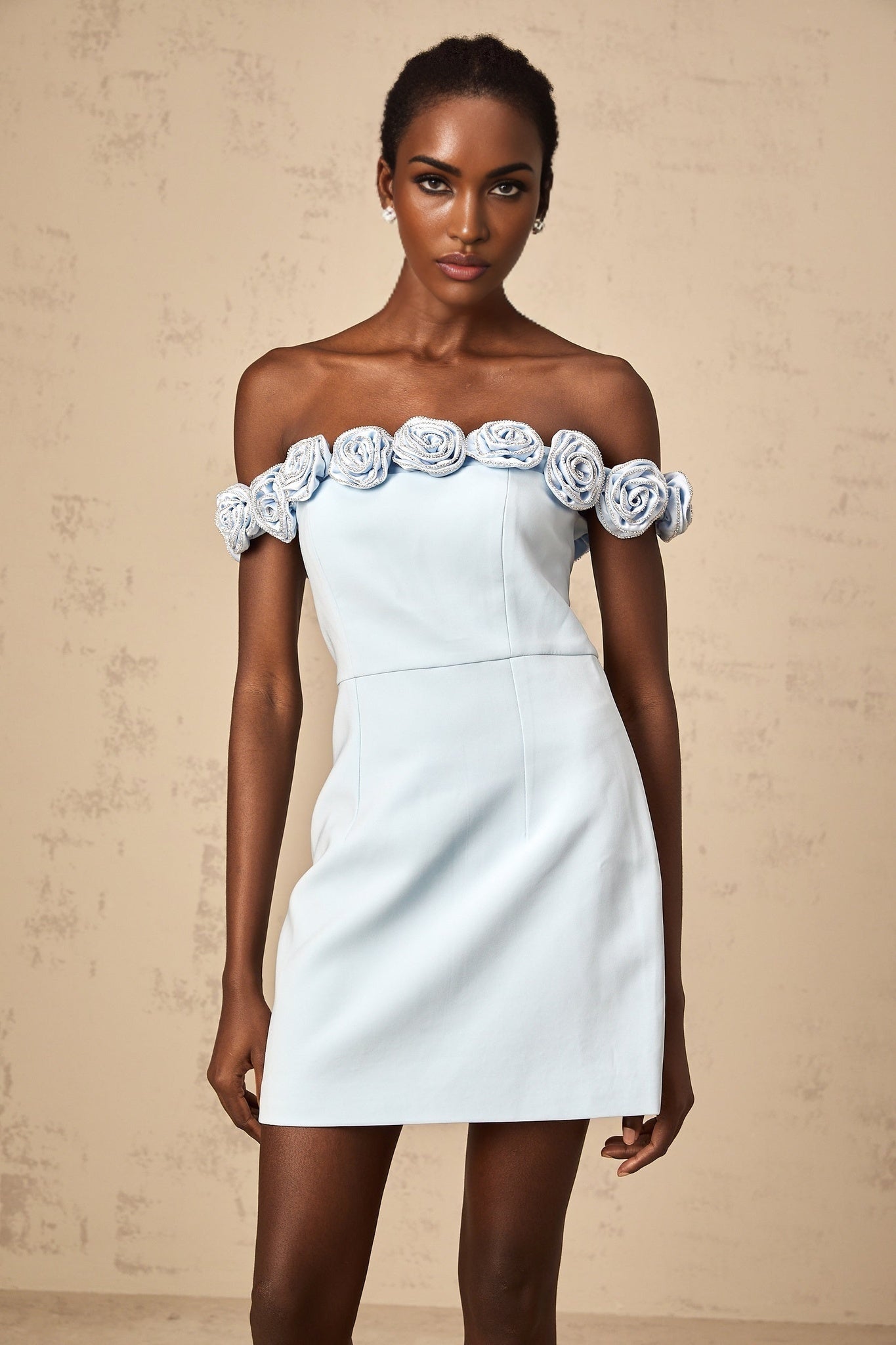 A blue mini dress with floral applique details named Hedwige