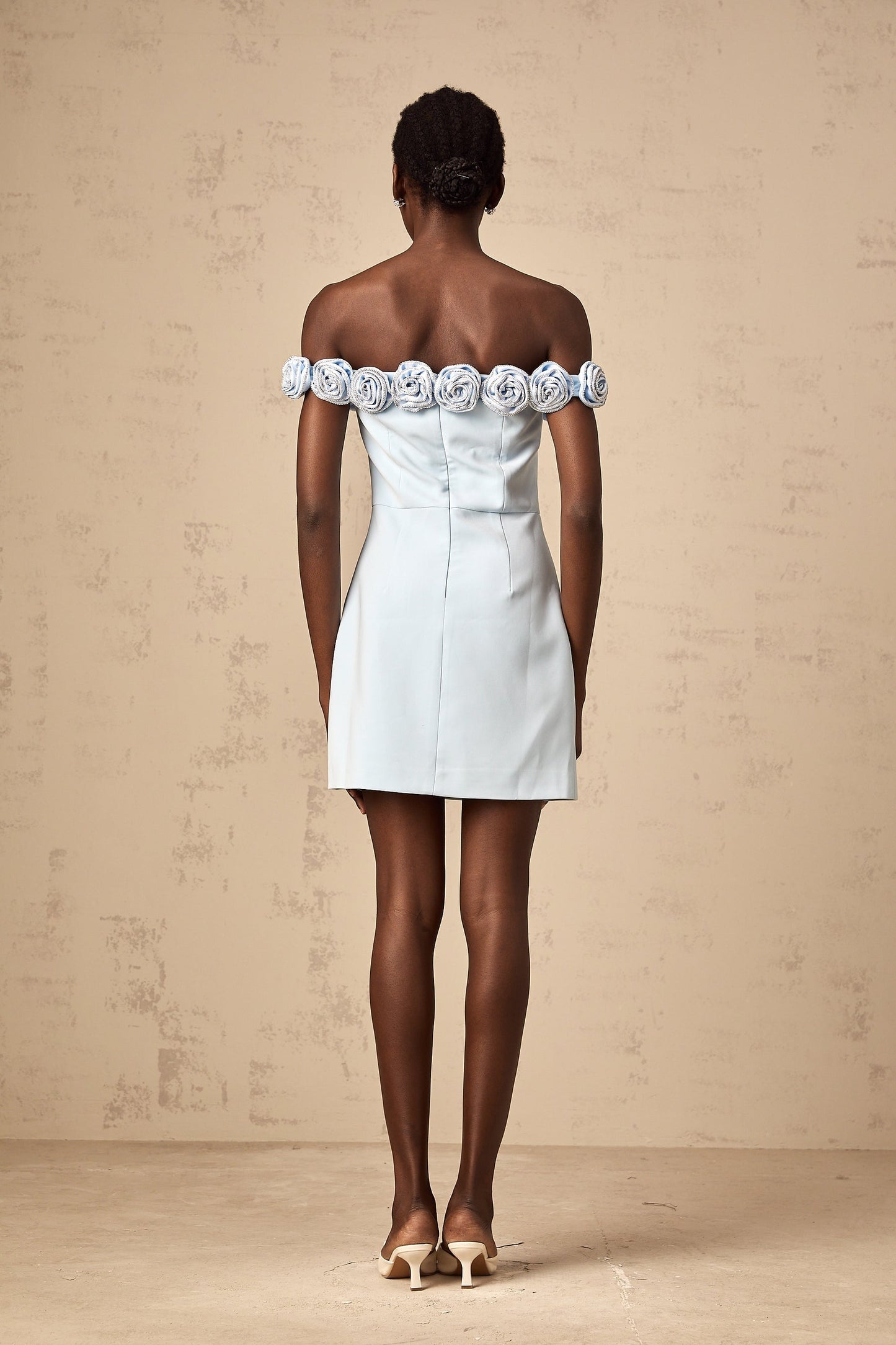 A blue mini dress with floral applique details named Hedwige