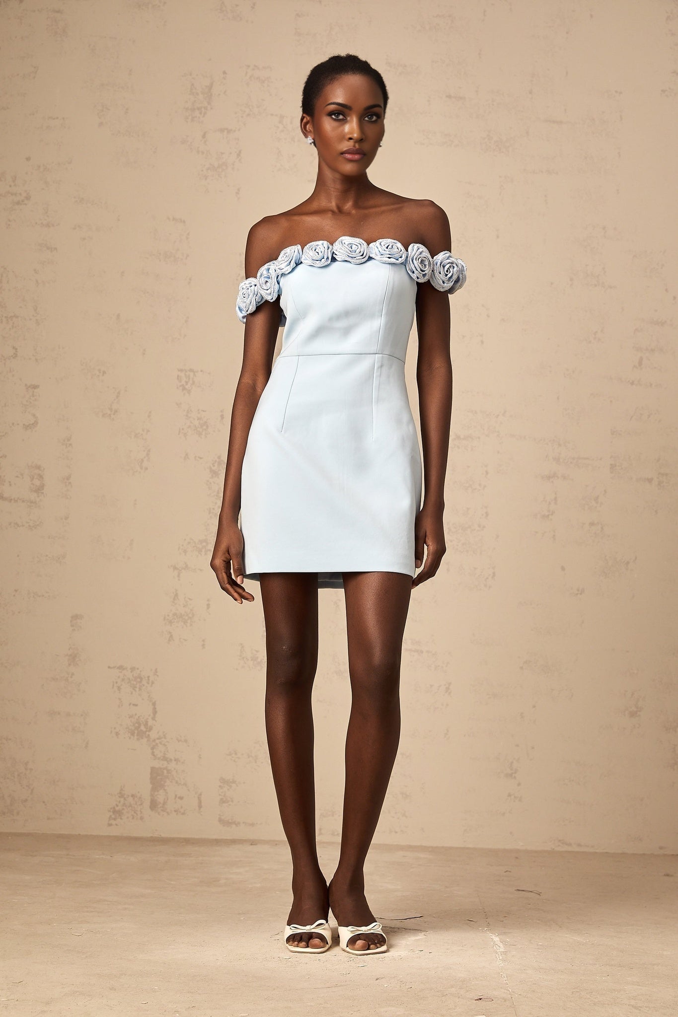 A blue mini dress with floral applique details named Hedwige