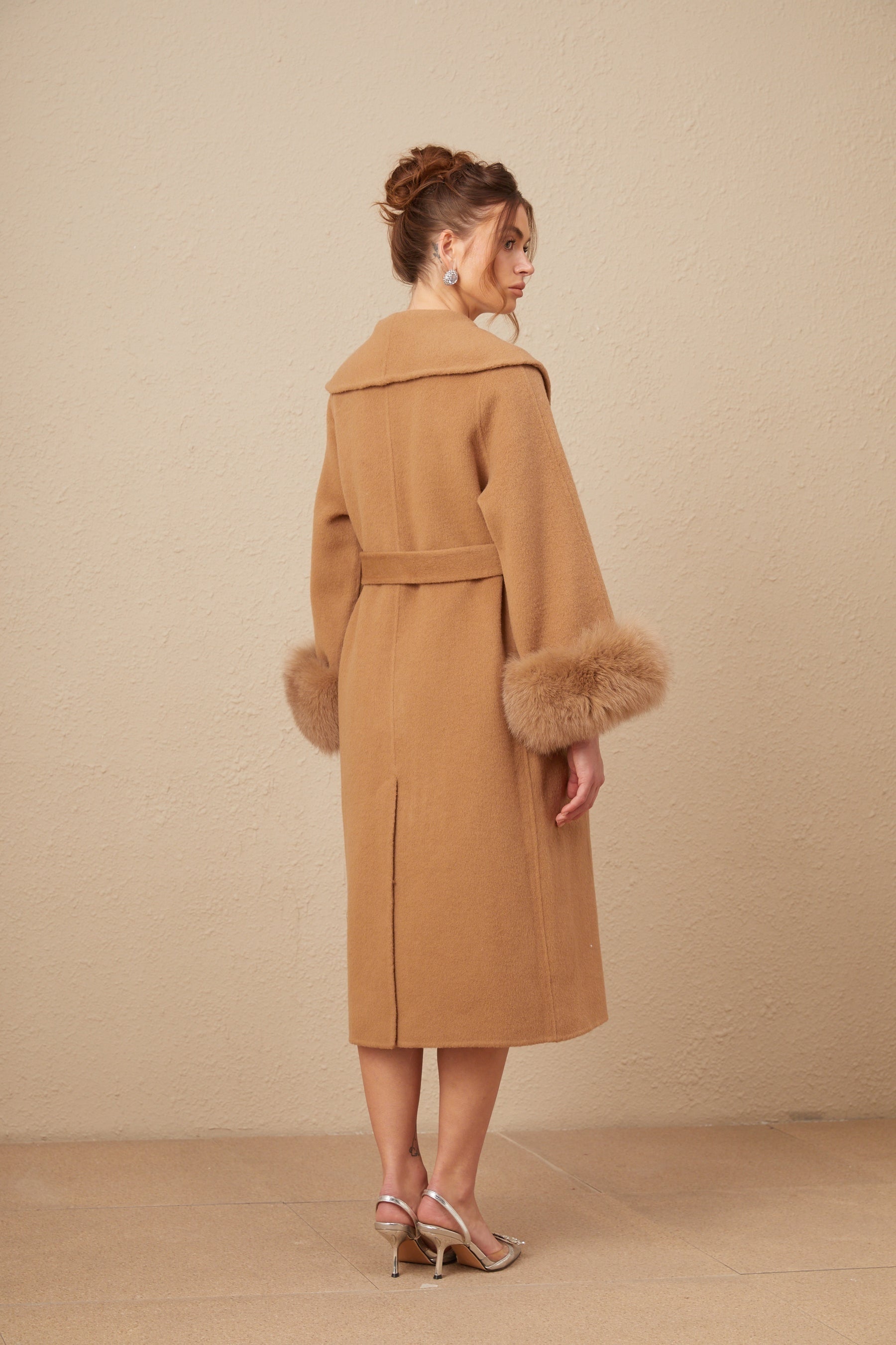 A brown felted wool wrap overcoat with a loose fit and long lapels