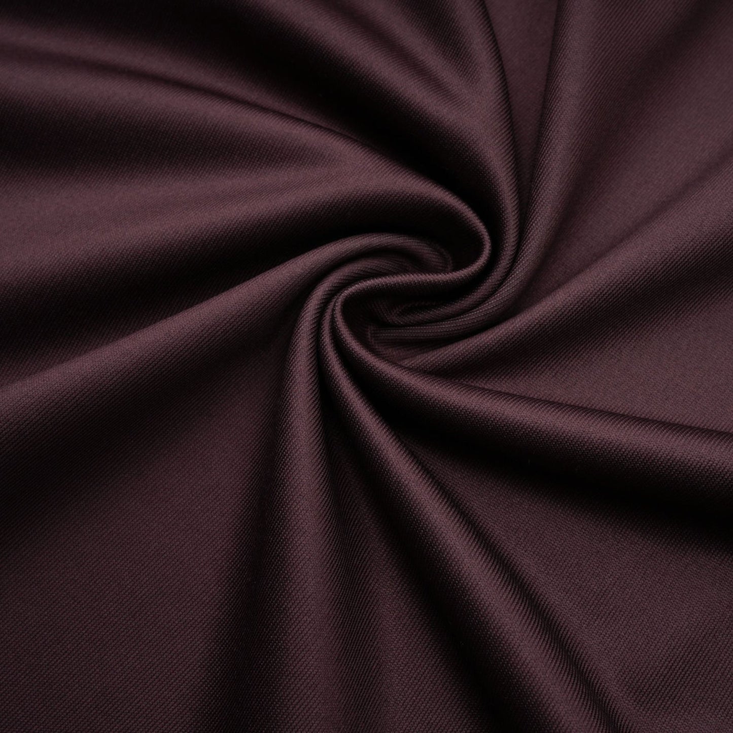 A brown flared midi dress made of chantilly lace named Sylvie worn by a model against a plain background