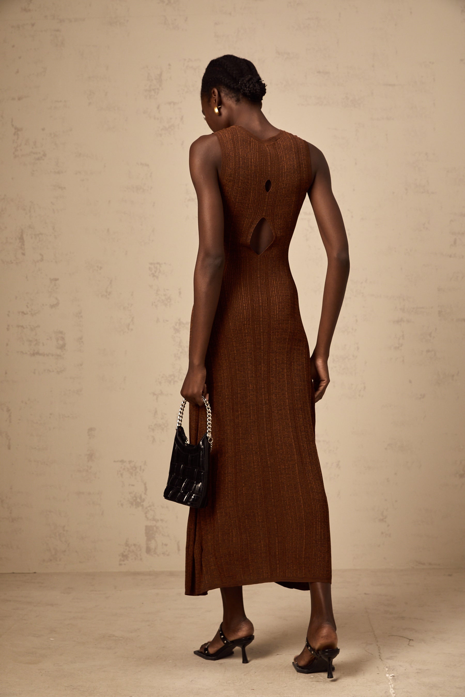 A brown knitted midi dress with cut out details called Aurore