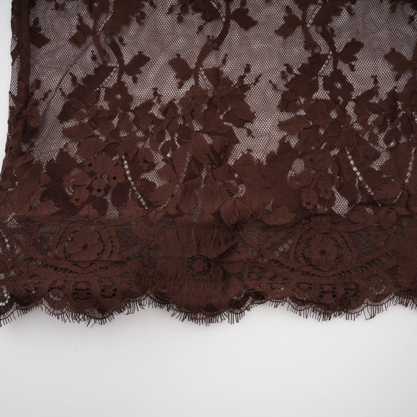 A brown midi dress with flared skirt made of chantilly lace named Sylvie
