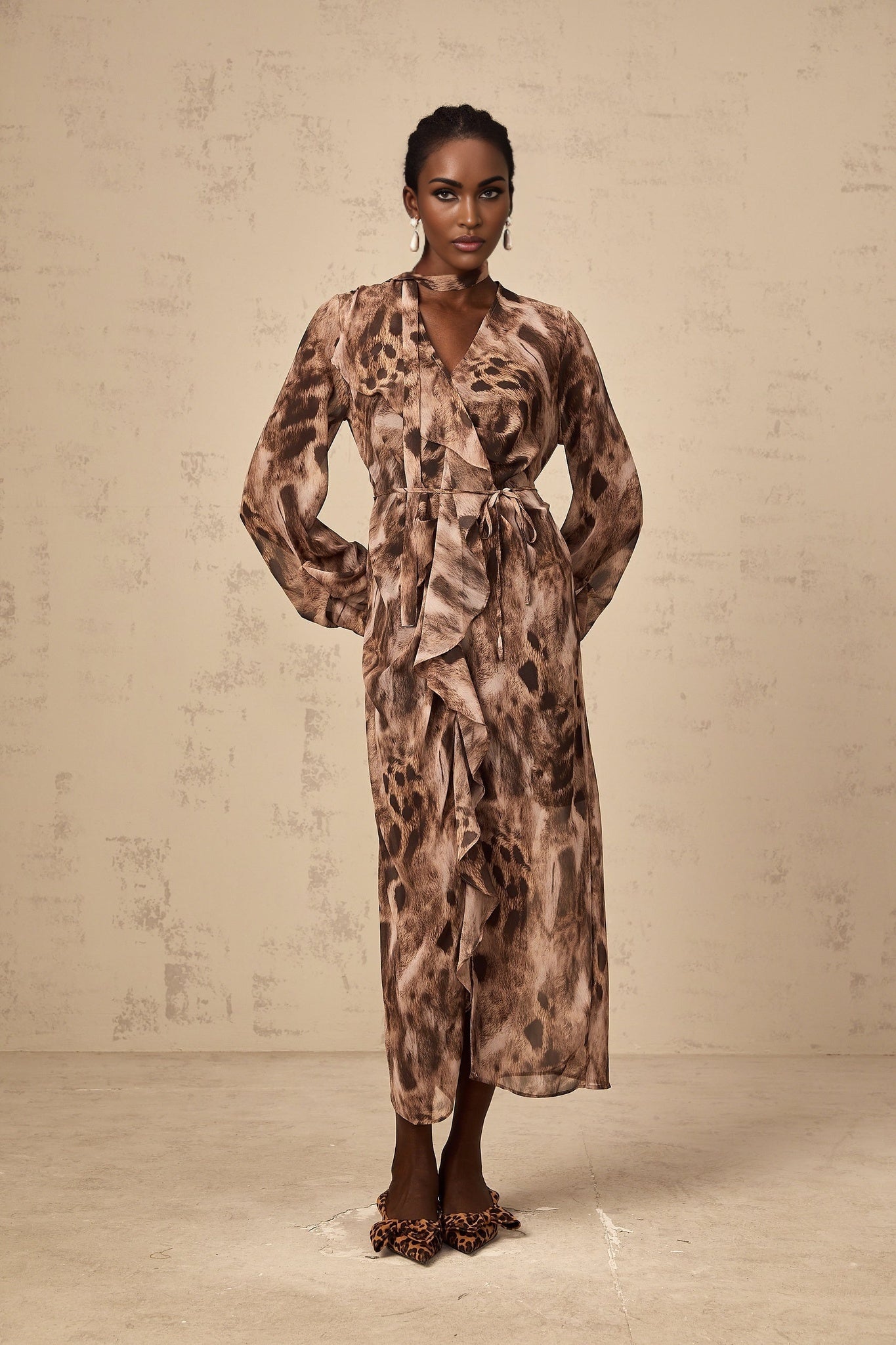 A brown midi dress with leopard print pattern and ruffled details named Sidonie