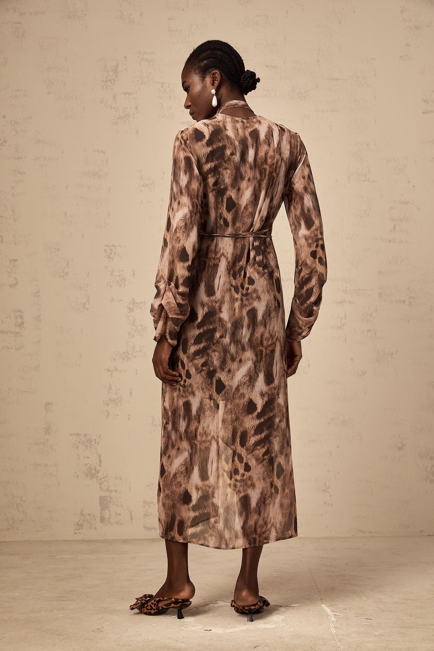 A brown midi dress with ruffled details and a leopard print pattern named Sidonie