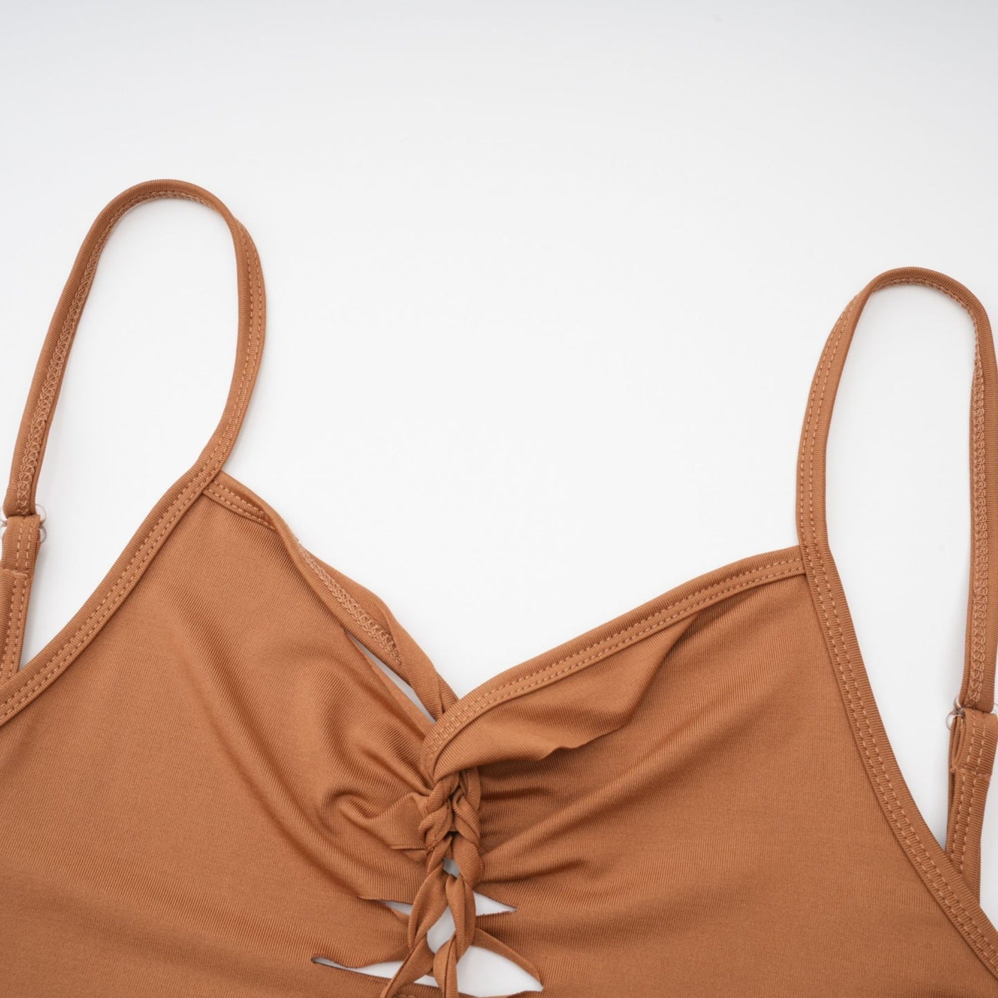 Spaghetti strap brown dress with V neck cutout design bodycon fit and thigh length in stretch jersey fabric includes gloves 95% Polyester 5% Spandex