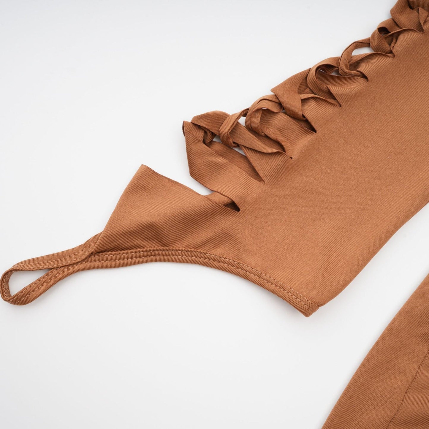 Brown spaghetti strap dress with Vneck cutout design bodycon fit gloves included thigh length composed of 95% Polyester 5% Spandex