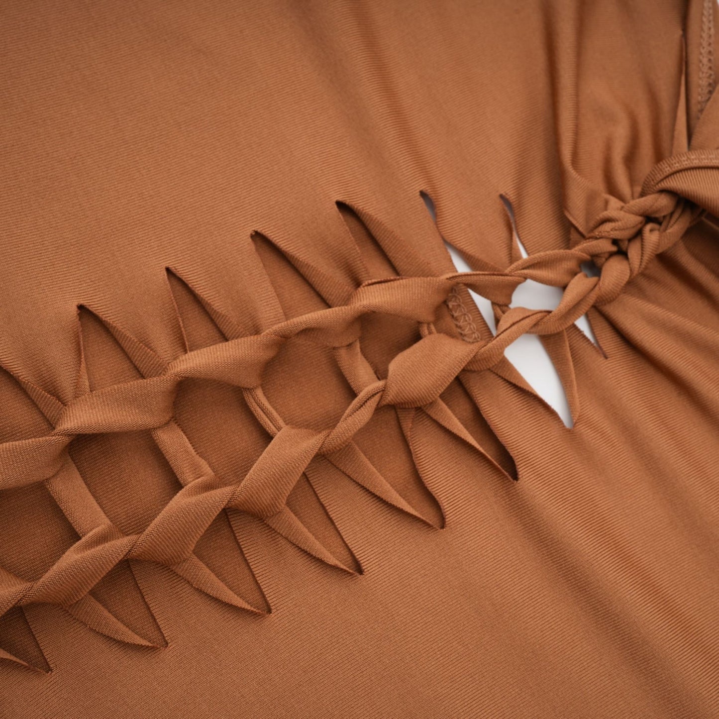Brown bodycon dress with spaghetti straps V neck cutout design and comes with gloves Made of 95% Polyester 5% Spandex