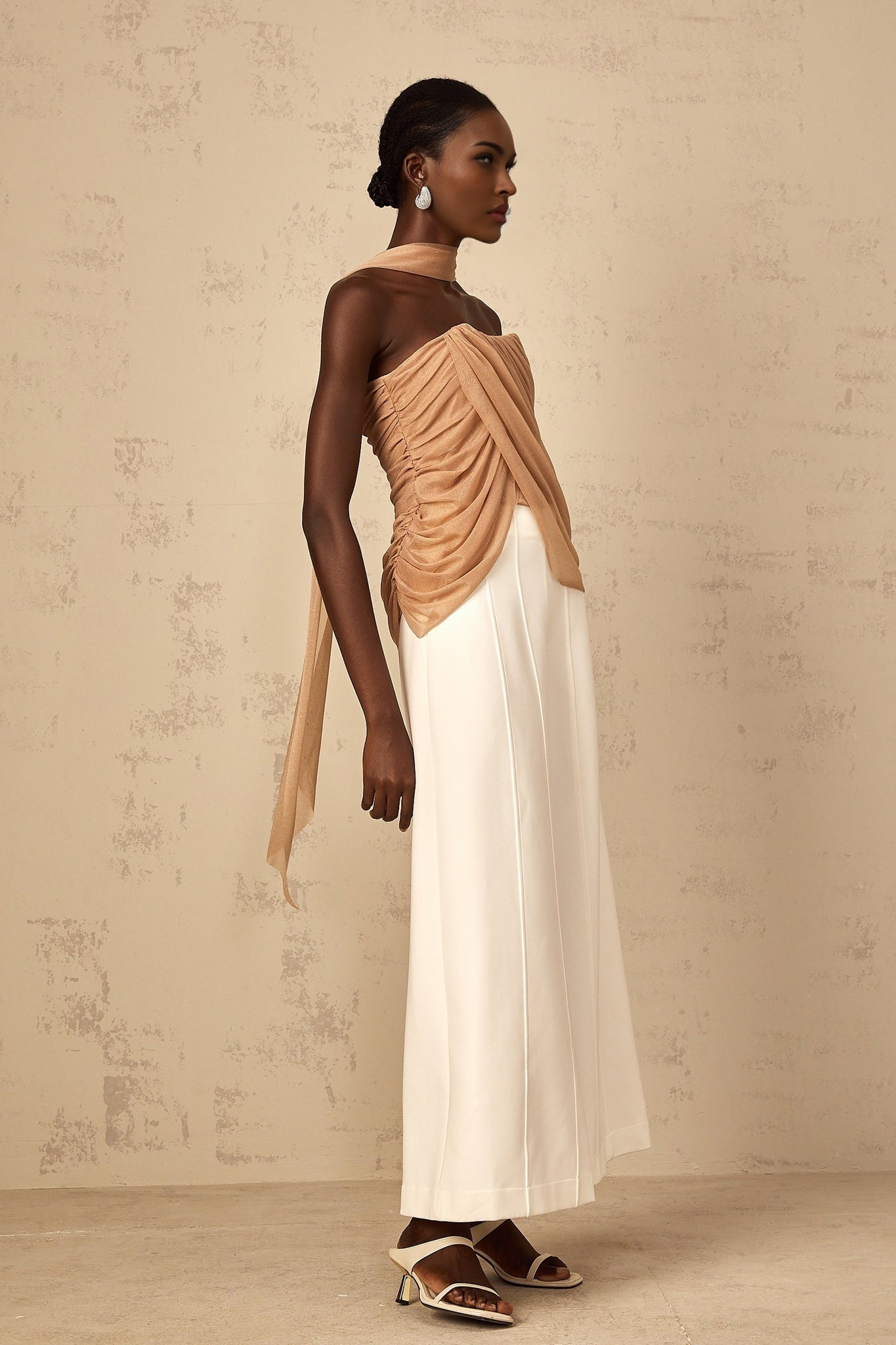 A brown tulle top with sequin embellishments and ruched detailing named Berenice