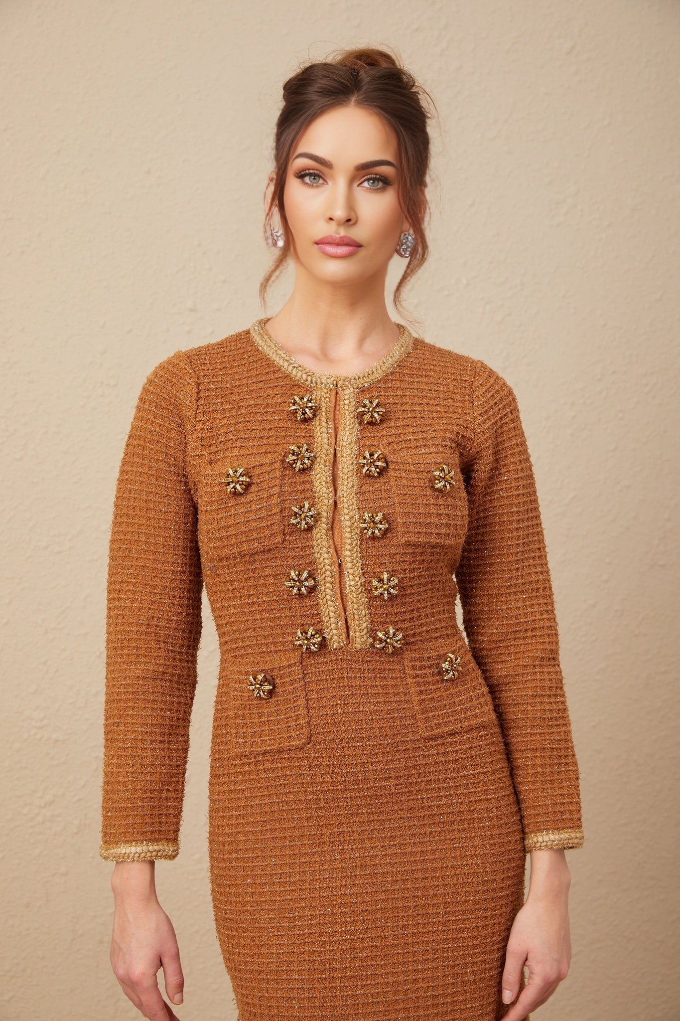 A brown tweed dress with braided edge details and a classic Epona design