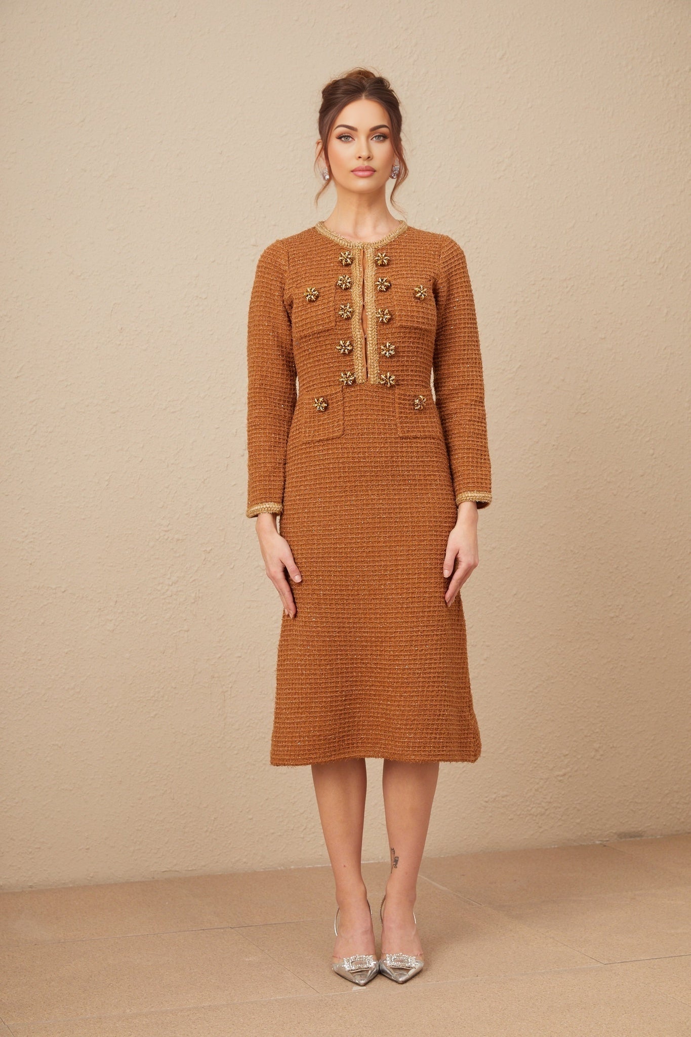 A brown tweed dress with braided edges and a design inspired by Epona featuring a classic silhouette