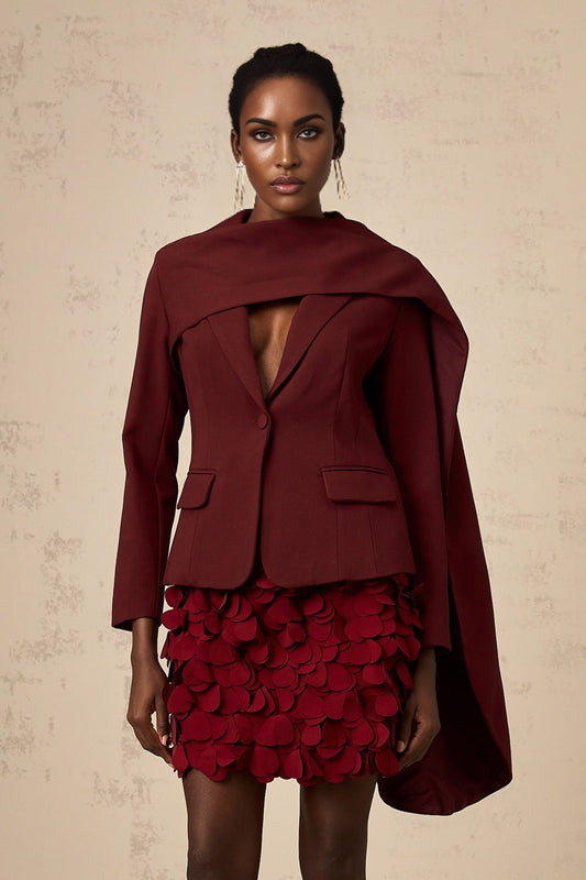 A burgundy colored jacket with a shawl collar and draped front detail named Coralie in a deep wine shade