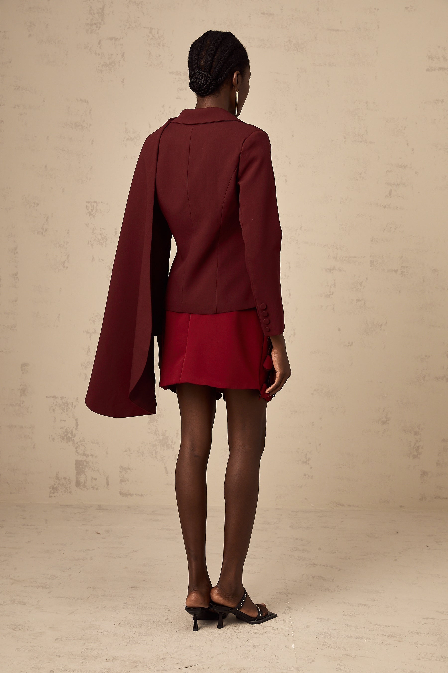 A burgundy colored jacket with shawllike detailing called Coralie in a deep wine shade